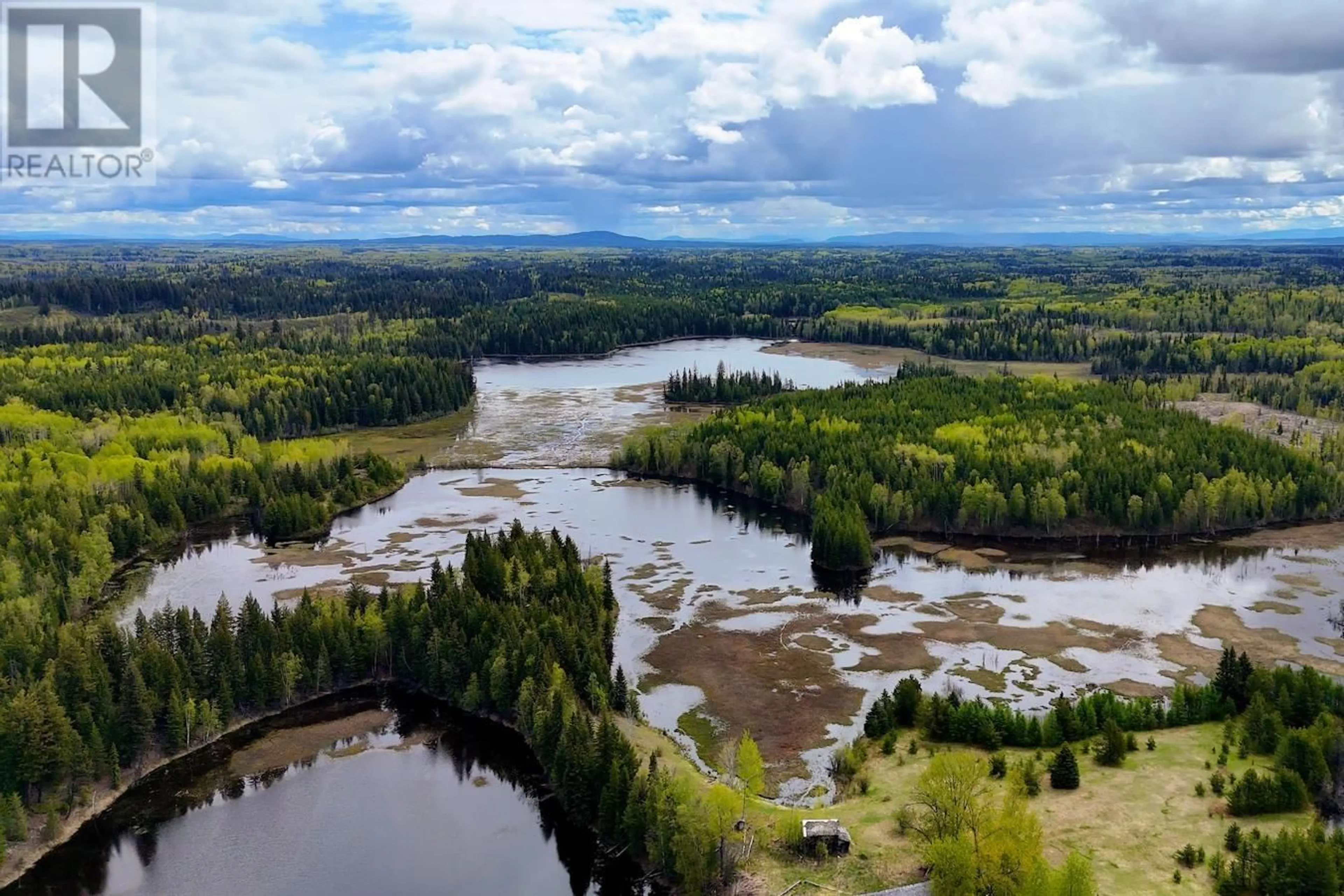A pic from outside/outdoor area/front of a property/back of a property/a pic from drone, water/lake/river/ocean view for 12450 VIVIAN LAKE ROAD, Prince George British Columbia V2K5N2