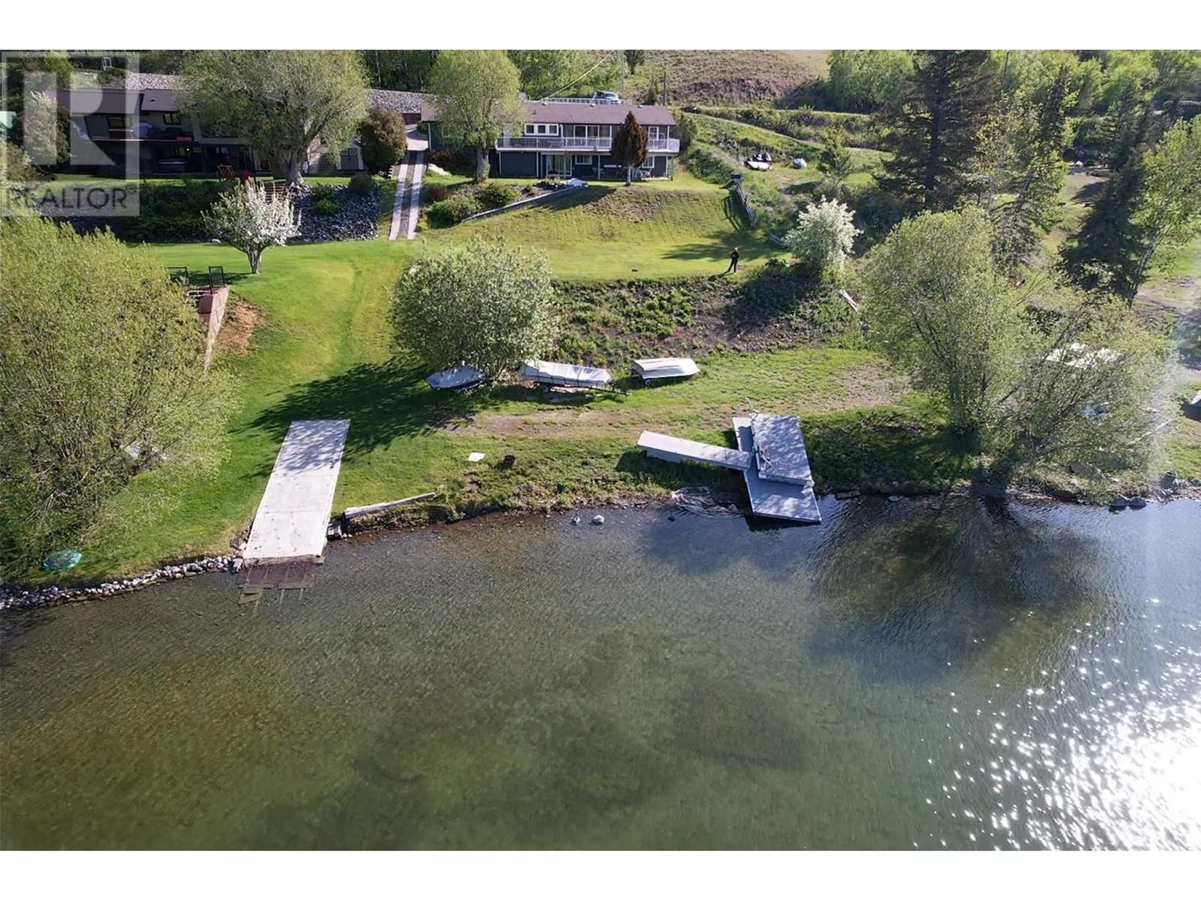 A pic from outside/outdoor area/front of a property/back of a property/a pic from drone, water/lake/river/ocean view for 4116 MCKINLEY DRIVE, Lac La Hache British Columbia V0K1M0