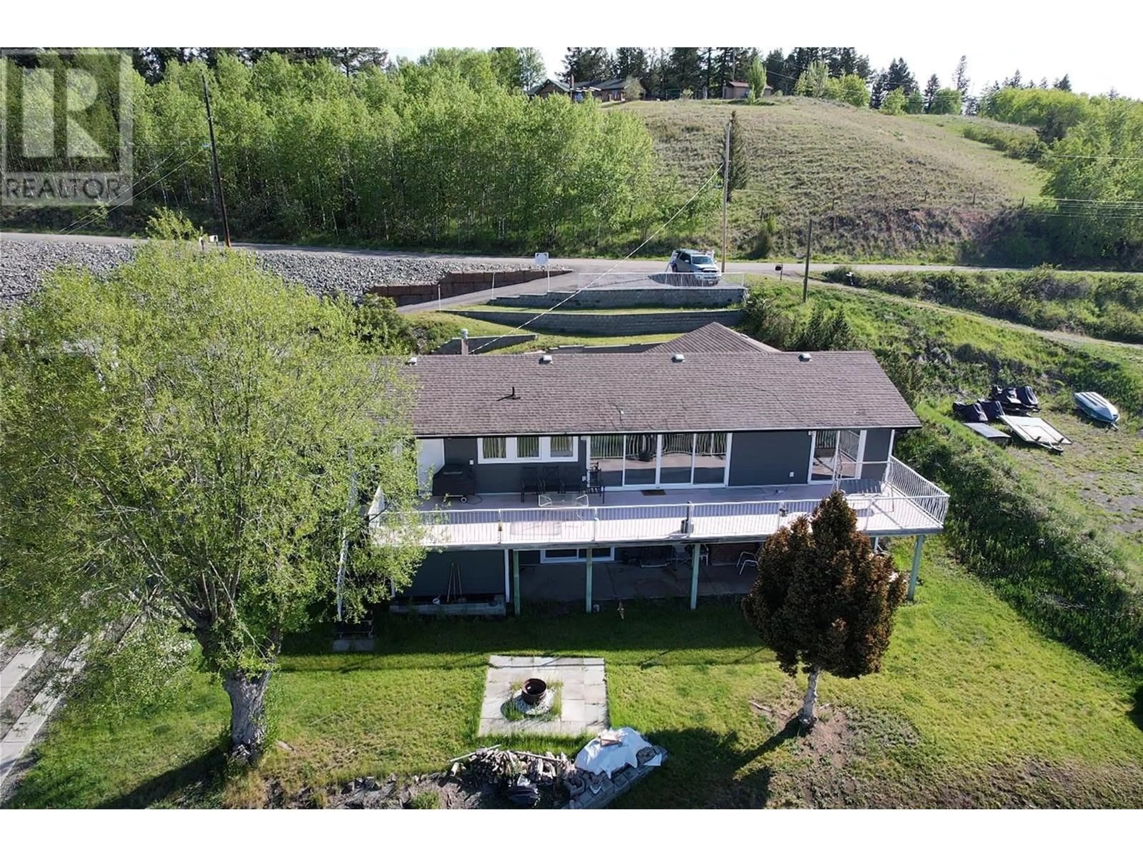 A pic from outside/outdoor area/front of a property/back of a property/a pic from drone, water/lake/river/ocean view for 4116 MCKINLEY DRIVE, Lac La Hache British Columbia V0K1M0