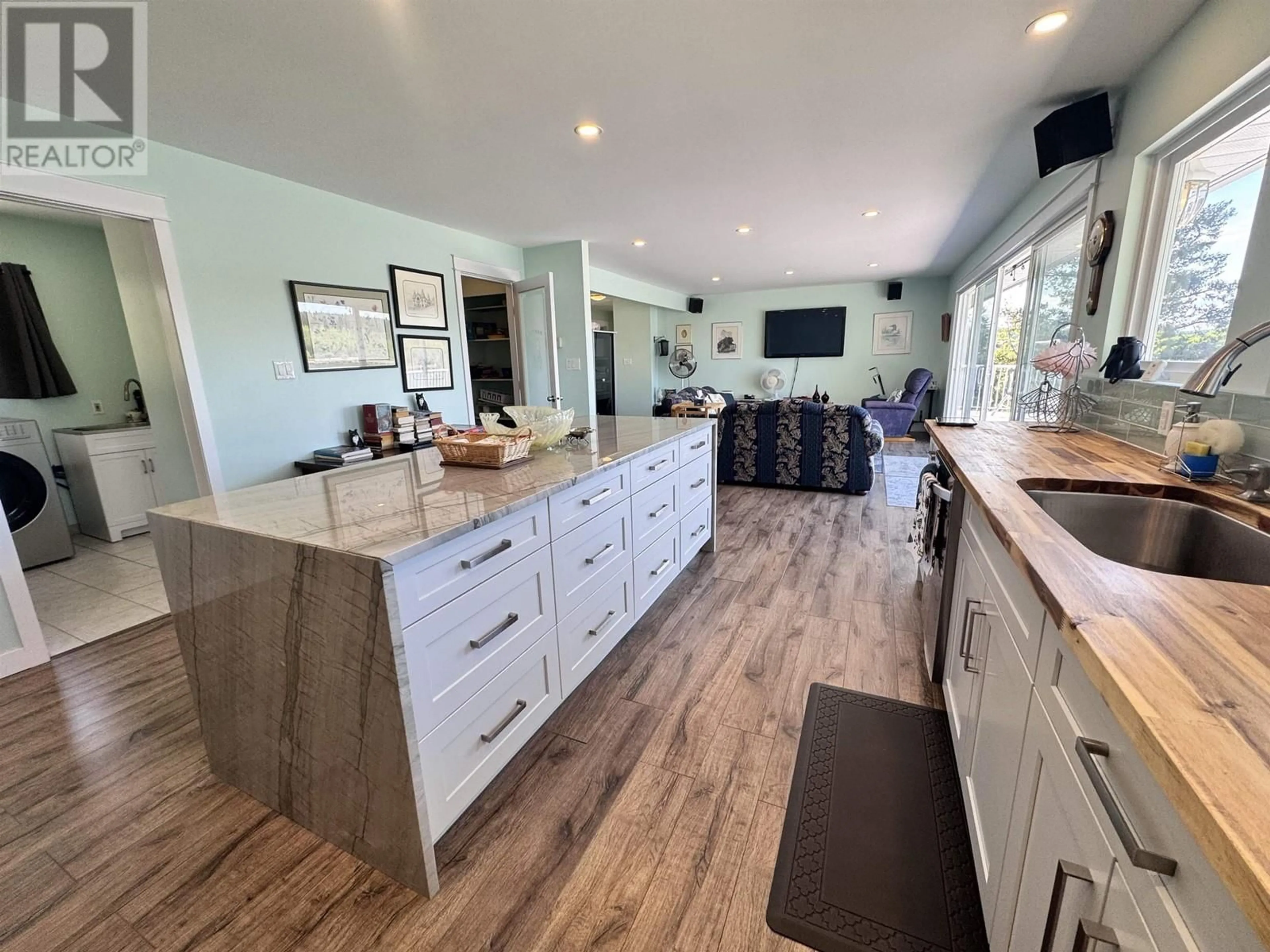 Open concept kitchen, wood/laminate floor for 4116 MCKINLEY DRIVE, Lac La Hache British Columbia V0K1M0