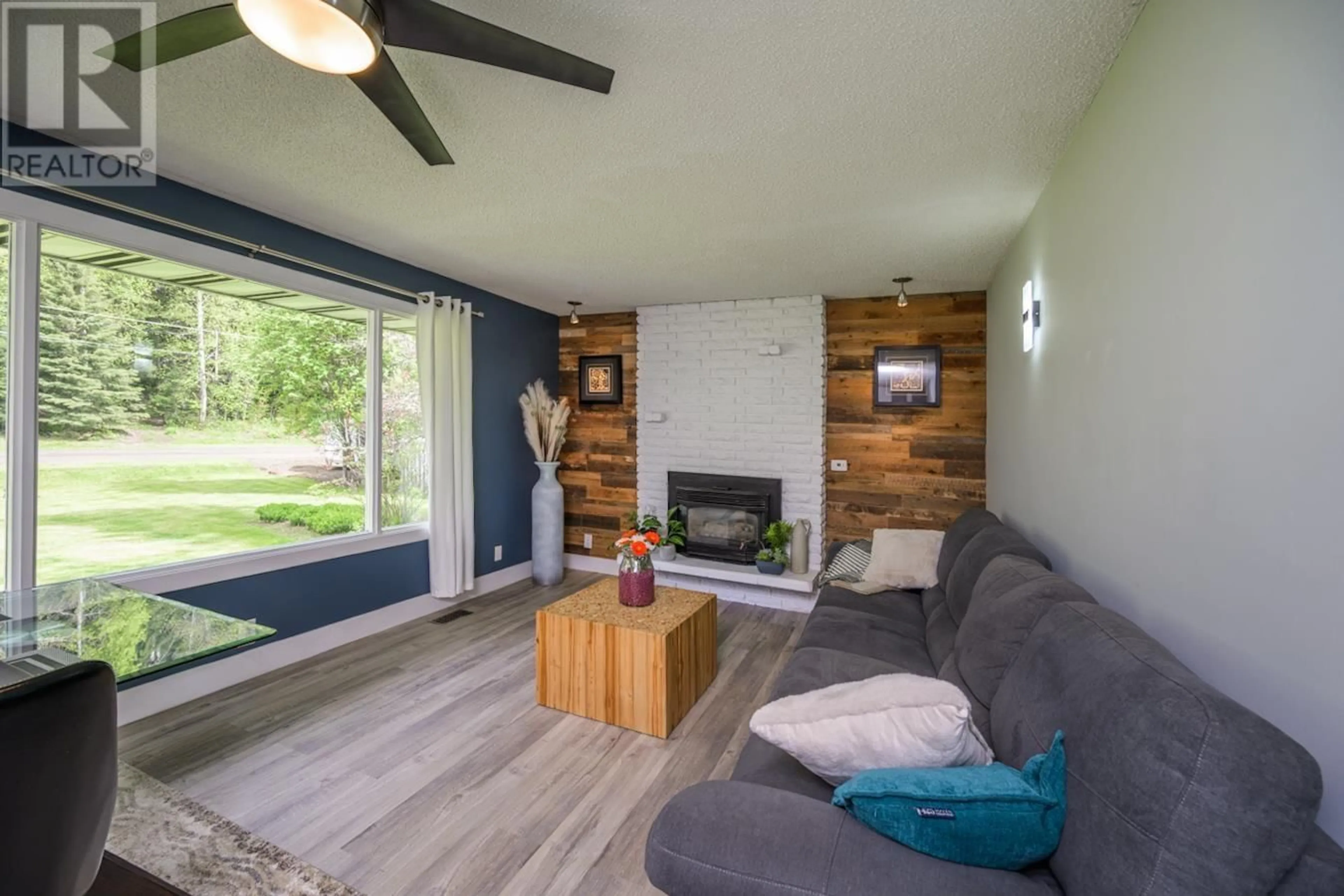 Living room with furniture, wood/laminate floor for 3545 MCLARTY CRESCENT, Prince George British Columbia V2K4Z3