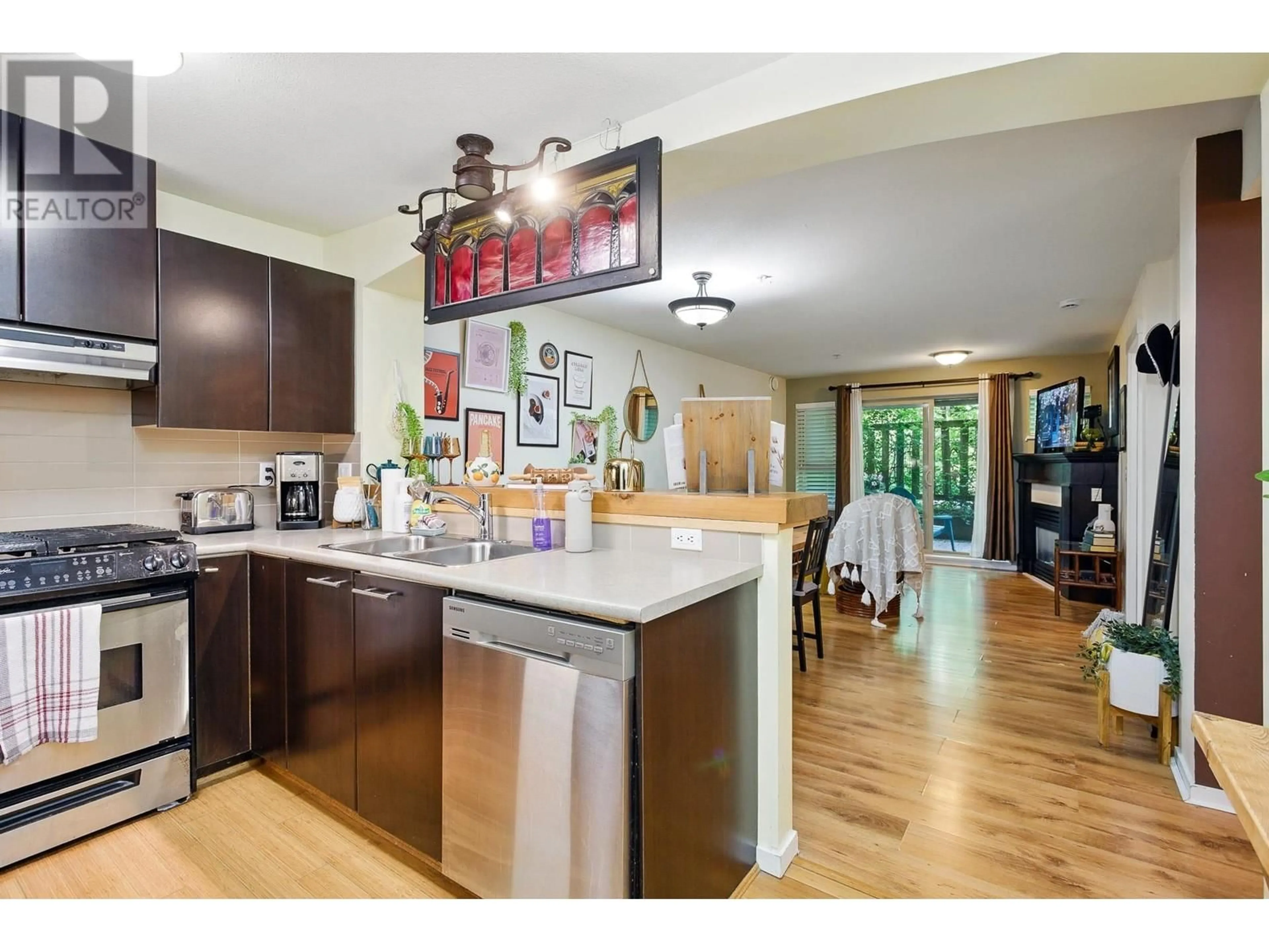 Open concept kitchen, unknown for 107 - 9329 UNIVERSITY CRESCENT, Burnaby British Columbia V5A4Y4