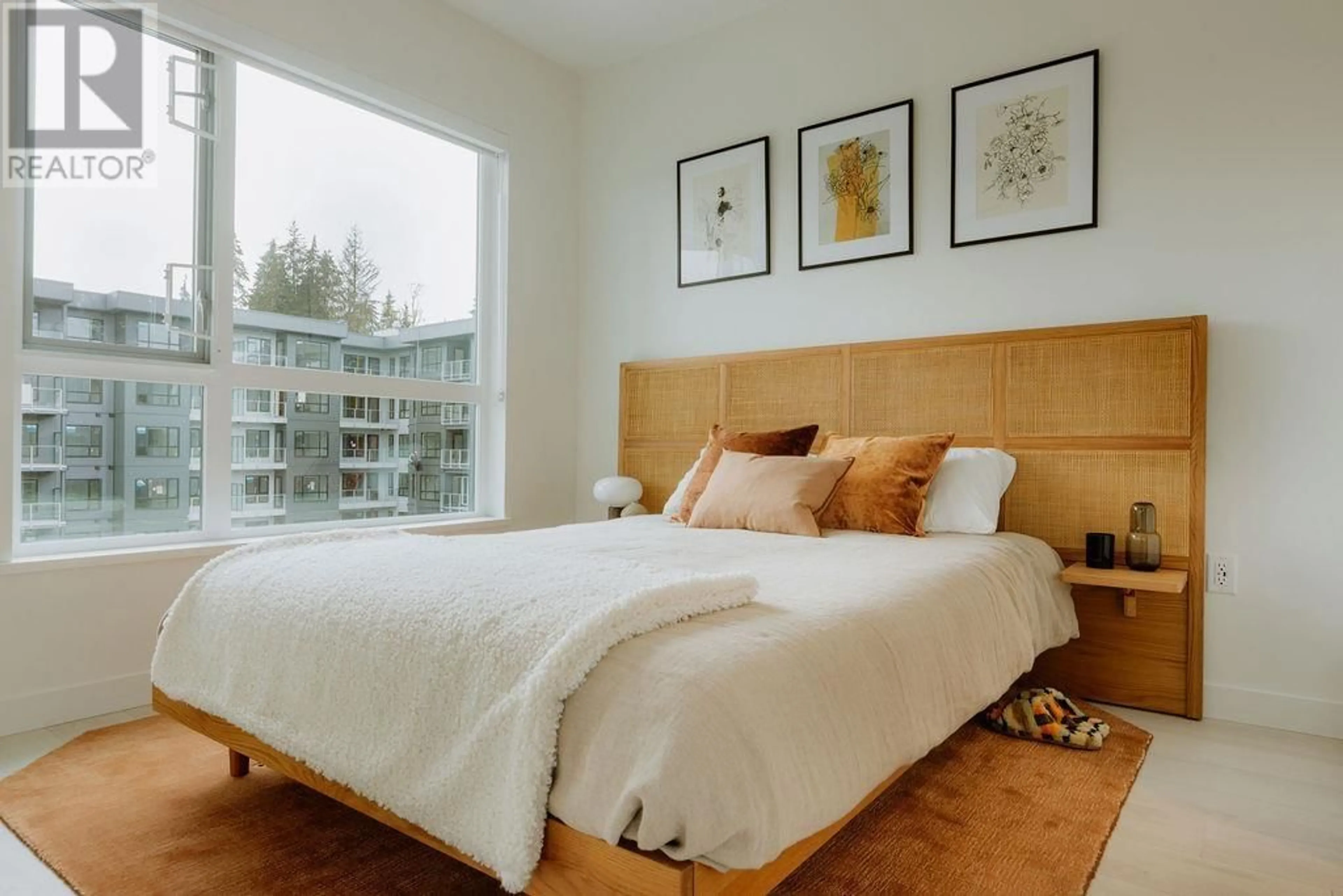 Bedroom with bed, wood/laminate floor for 409 - 3594 MALSUM DRIVE, North Vancouver British Columbia V0V0V0