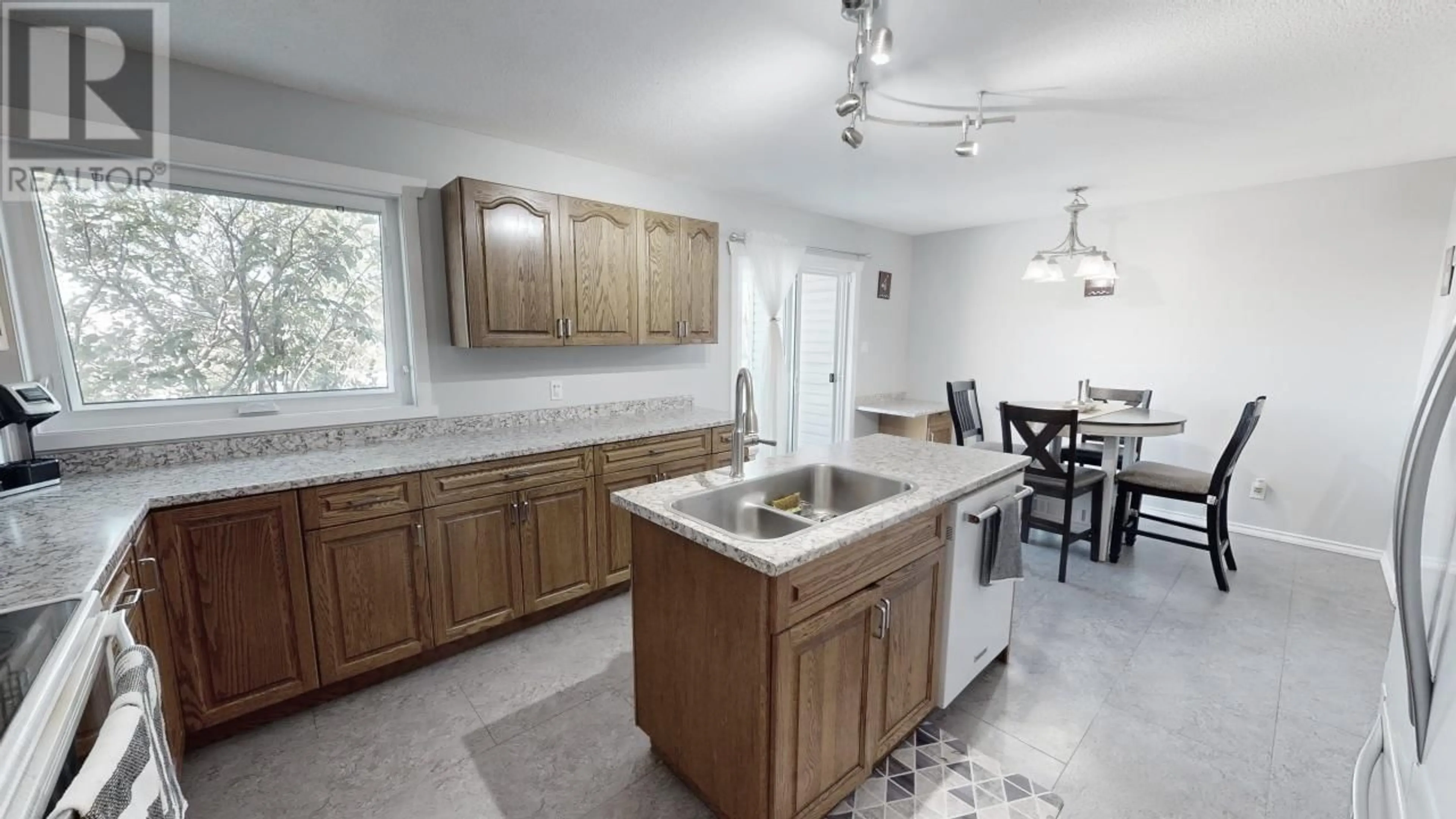 Open concept kitchen, ceramic/tile floor for 9024 114 AVENUE, Fort St. John British Columbia V1J5J1