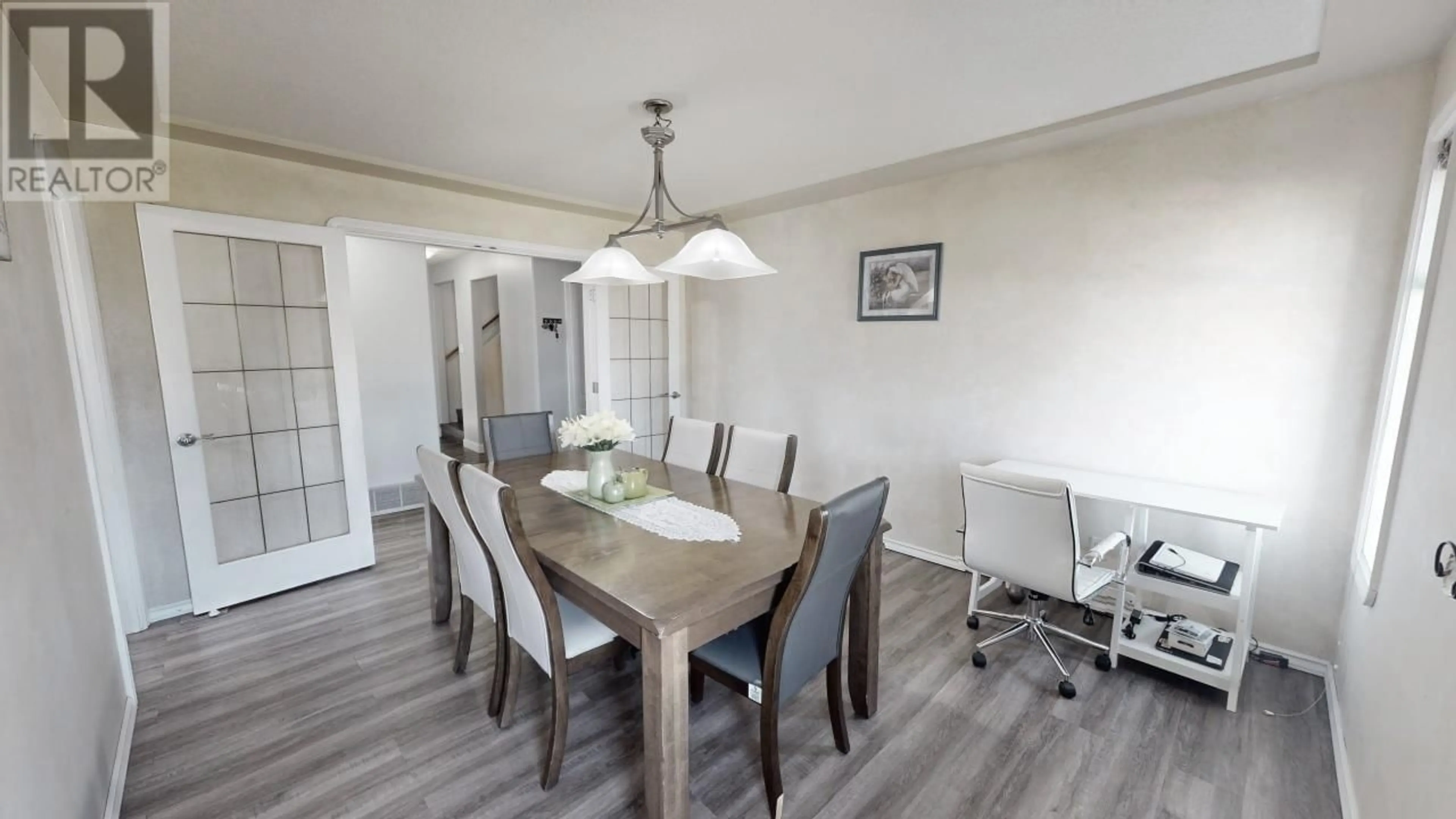 Dining room, wood/laminate floor for 9024 114 AVENUE, Fort St. John British Columbia V1J5J1