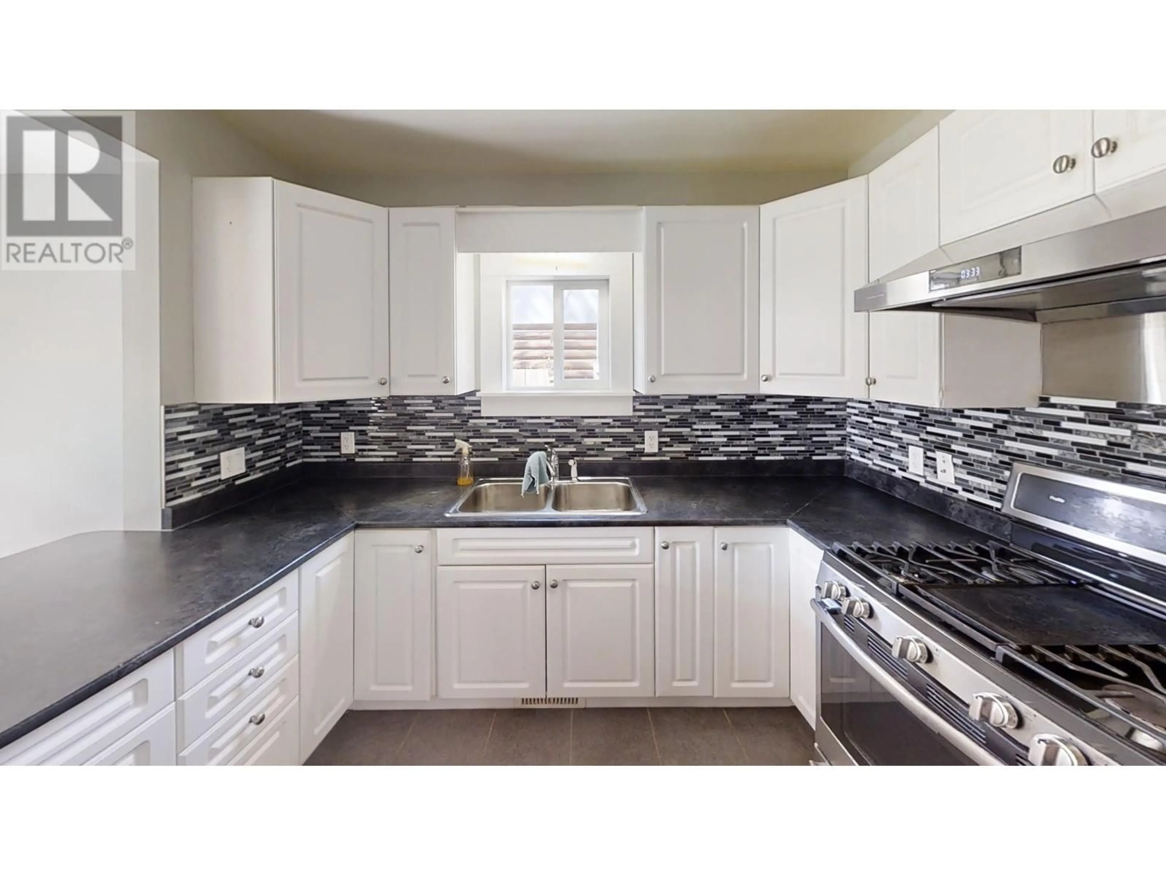 Standard kitchen, ceramic/tile floor for 446 JONES STREET, Quesnel British Columbia V2J2W9