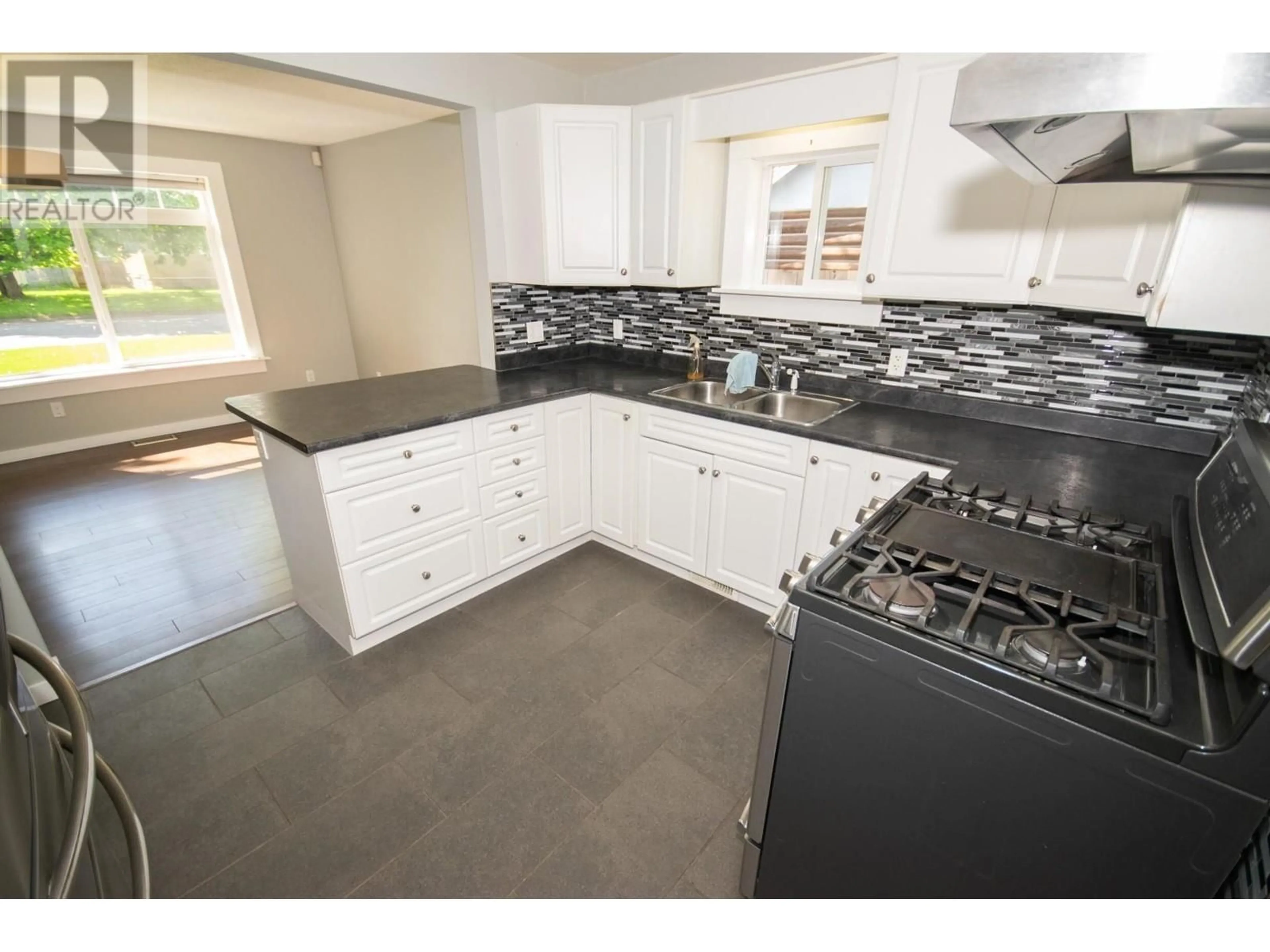 Open concept kitchen, ceramic/tile floor for 446 JONES STREET, Quesnel British Columbia V2J2W9