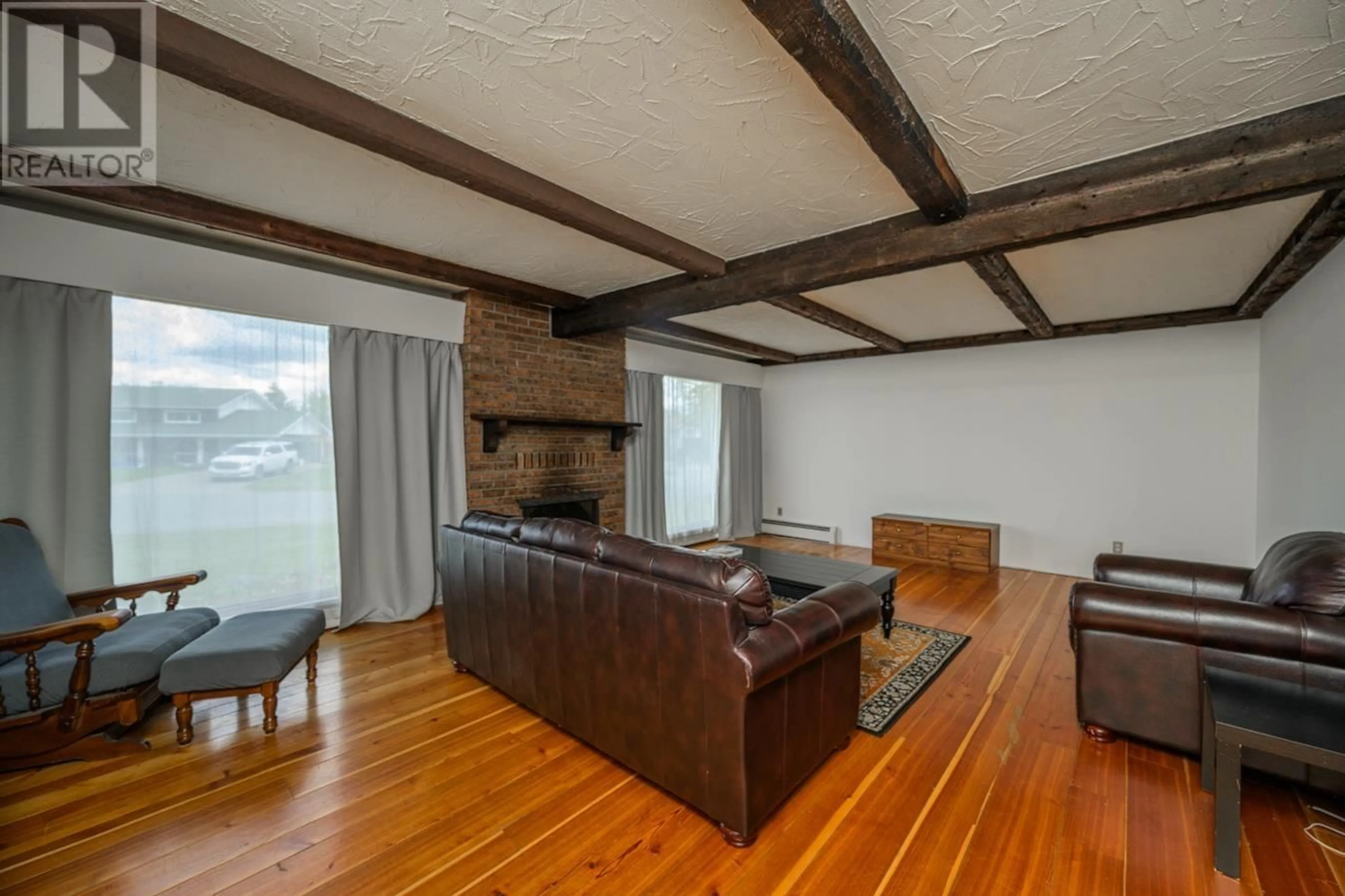 Living room with furniture, wood/laminate floor for 4339 EAGLENEST CRESCENT, Prince George British Columbia V2M4Y5
