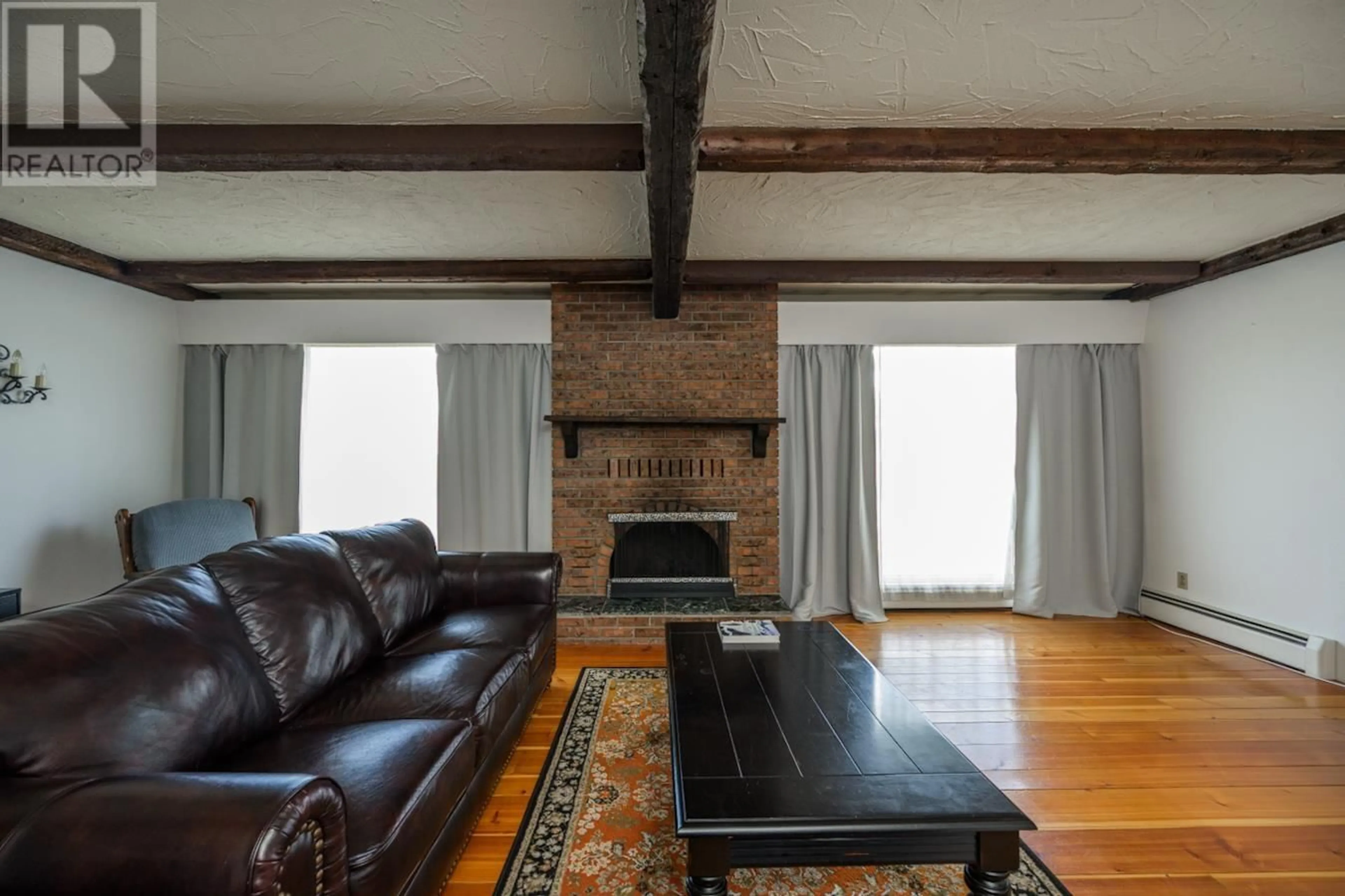 Living room with furniture, wood/laminate floor for 4339 EAGLENEST CRESCENT, Prince George British Columbia V2M4Y5