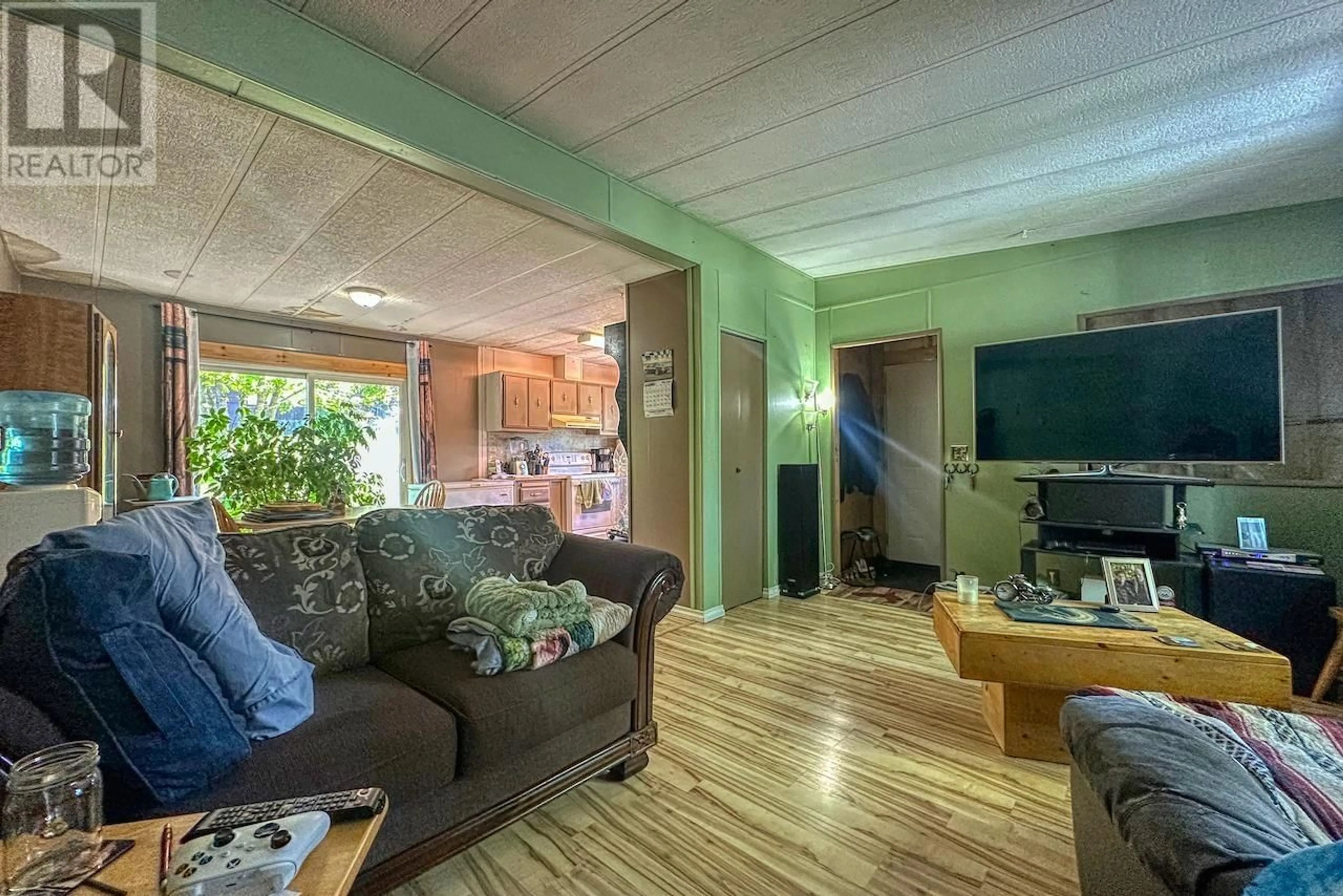 Living room with furniture, wood/laminate floor for 22 - 2155 COMMODORE CRESCENT, Williams Lake British Columbia V2G5E1