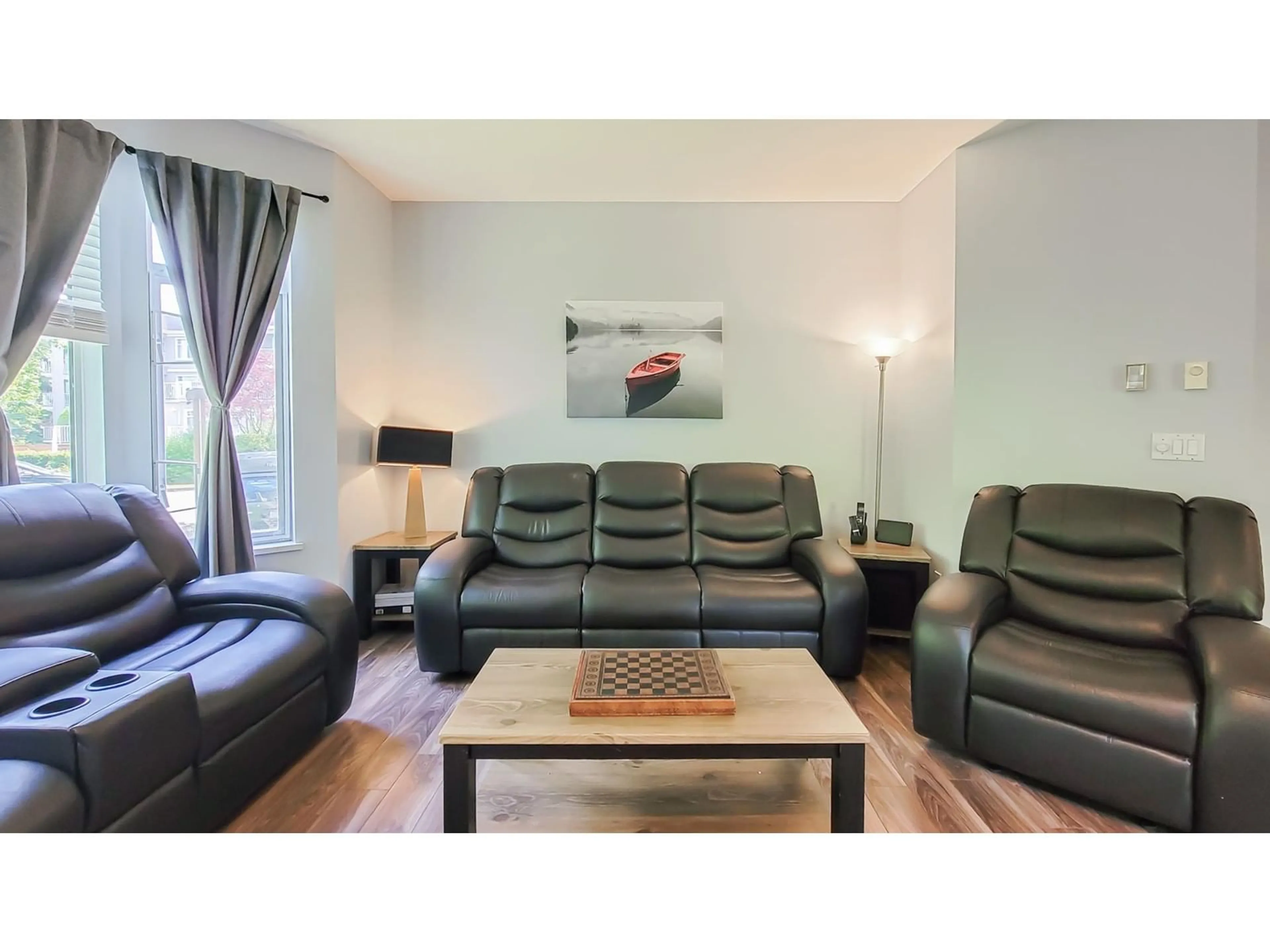Living room with furniture, wood/laminate floor for 111 - 20897 57, Langley British Columbia V3A8L5