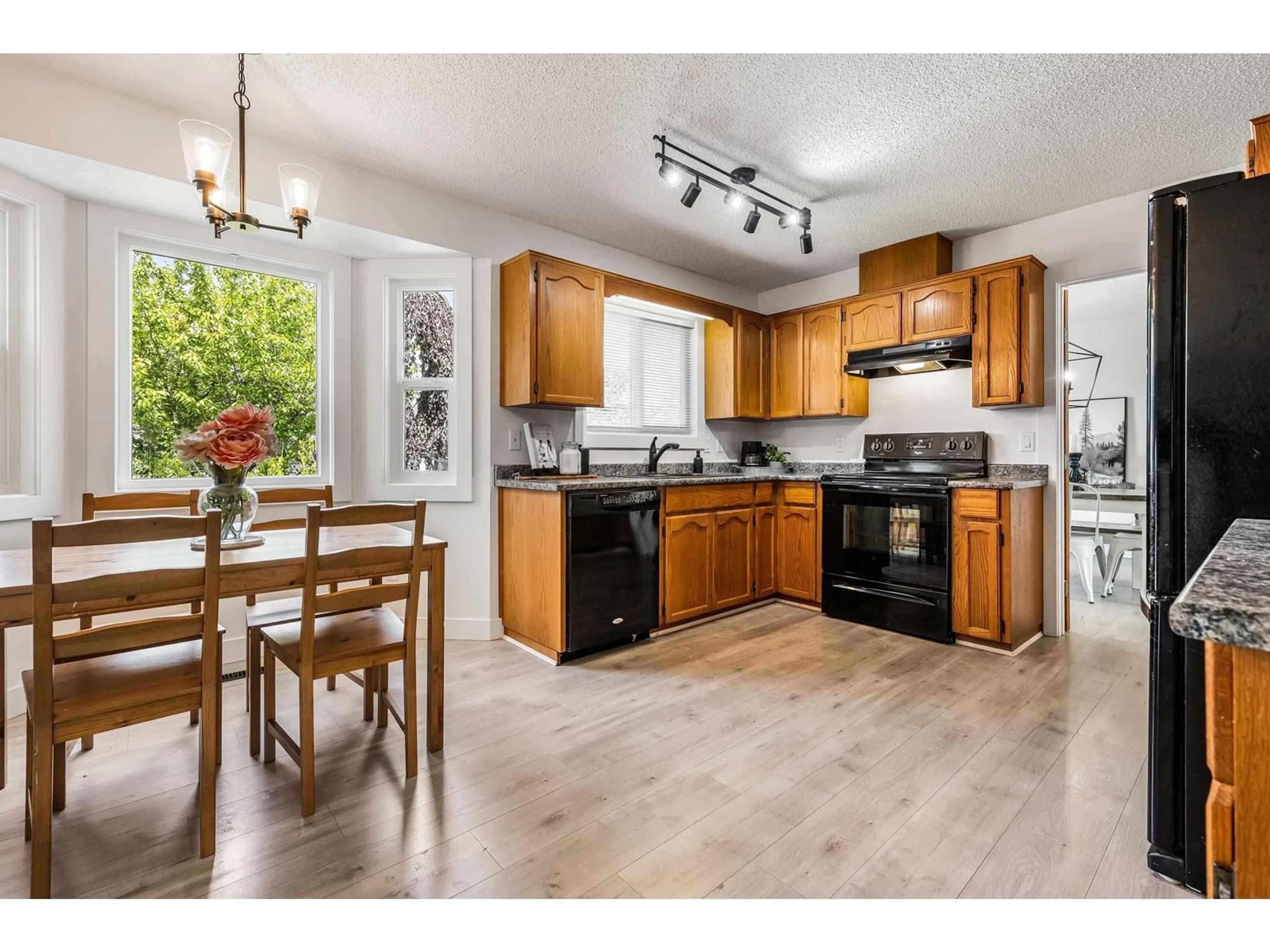 Open concept kitchen, wood/laminate floor for 44983 CUMBERLAND AVENUE, Chilliwack British Columbia V2R3C2