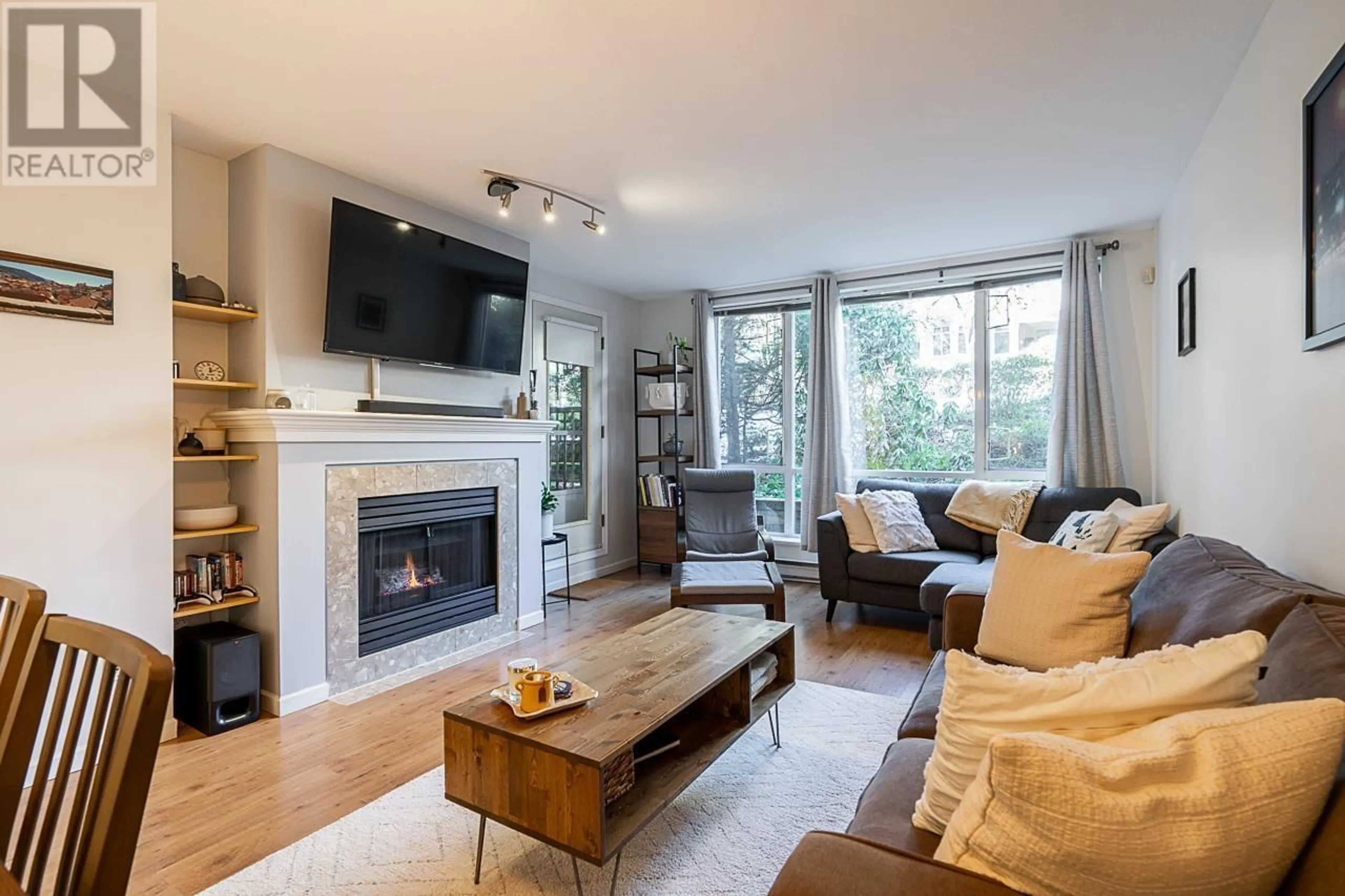 Living room with furniture, wood/laminate floor for 206 - 6742 STATION HILL COURT, Burnaby British Columbia V3N4V2