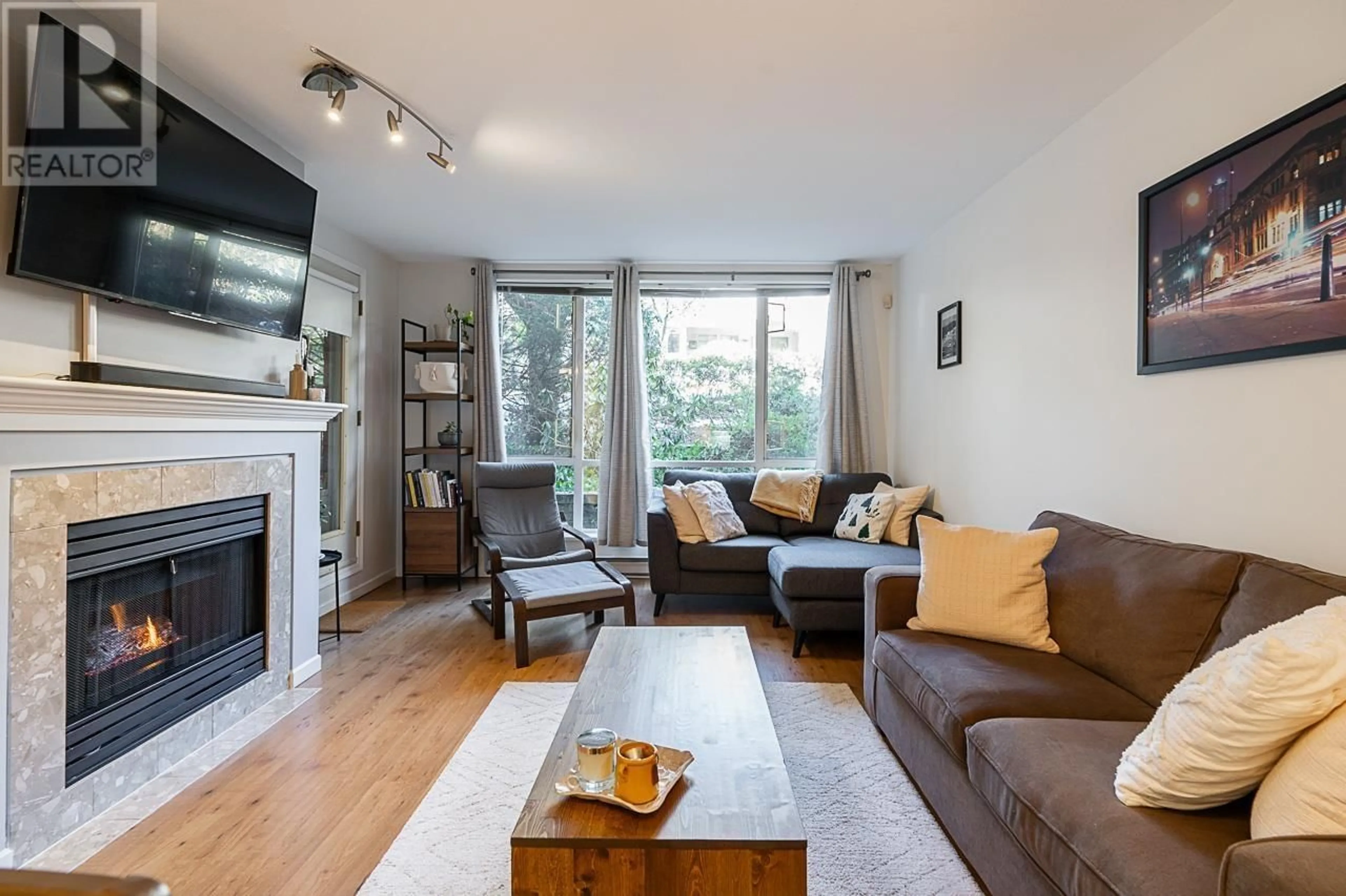 Living room with furniture, wood/laminate floor for 206 - 6742 STATION HILL COURT, Burnaby British Columbia V3N4V2