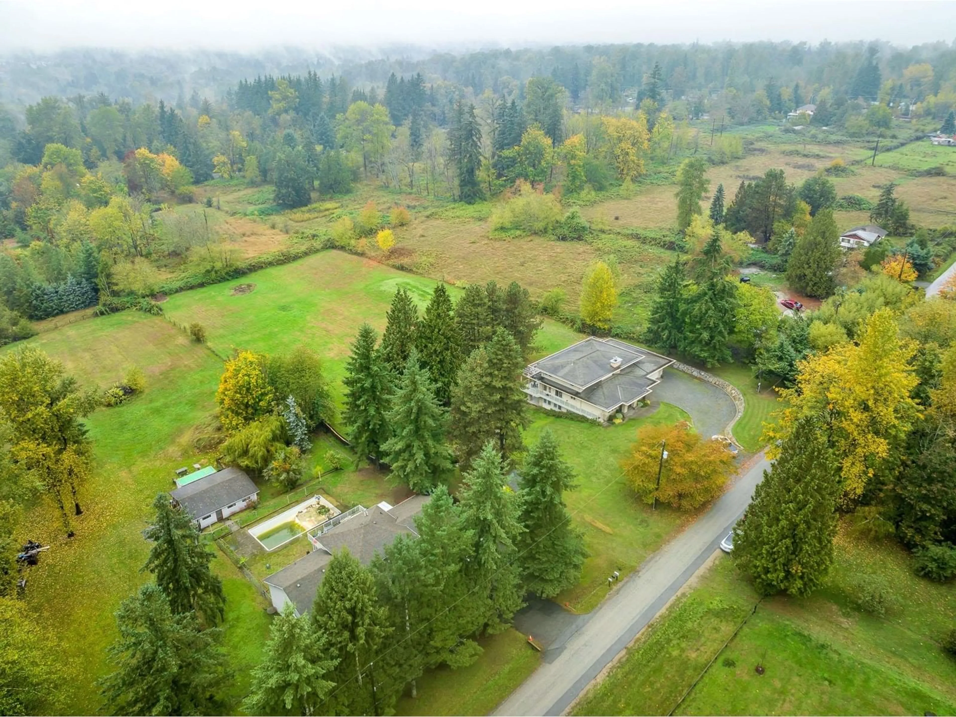 A pic from outside/outdoor area/front of a property/back of a property/a pic from drone, forest/trees view for 9385 173A, Surrey British Columbia V4N6H6