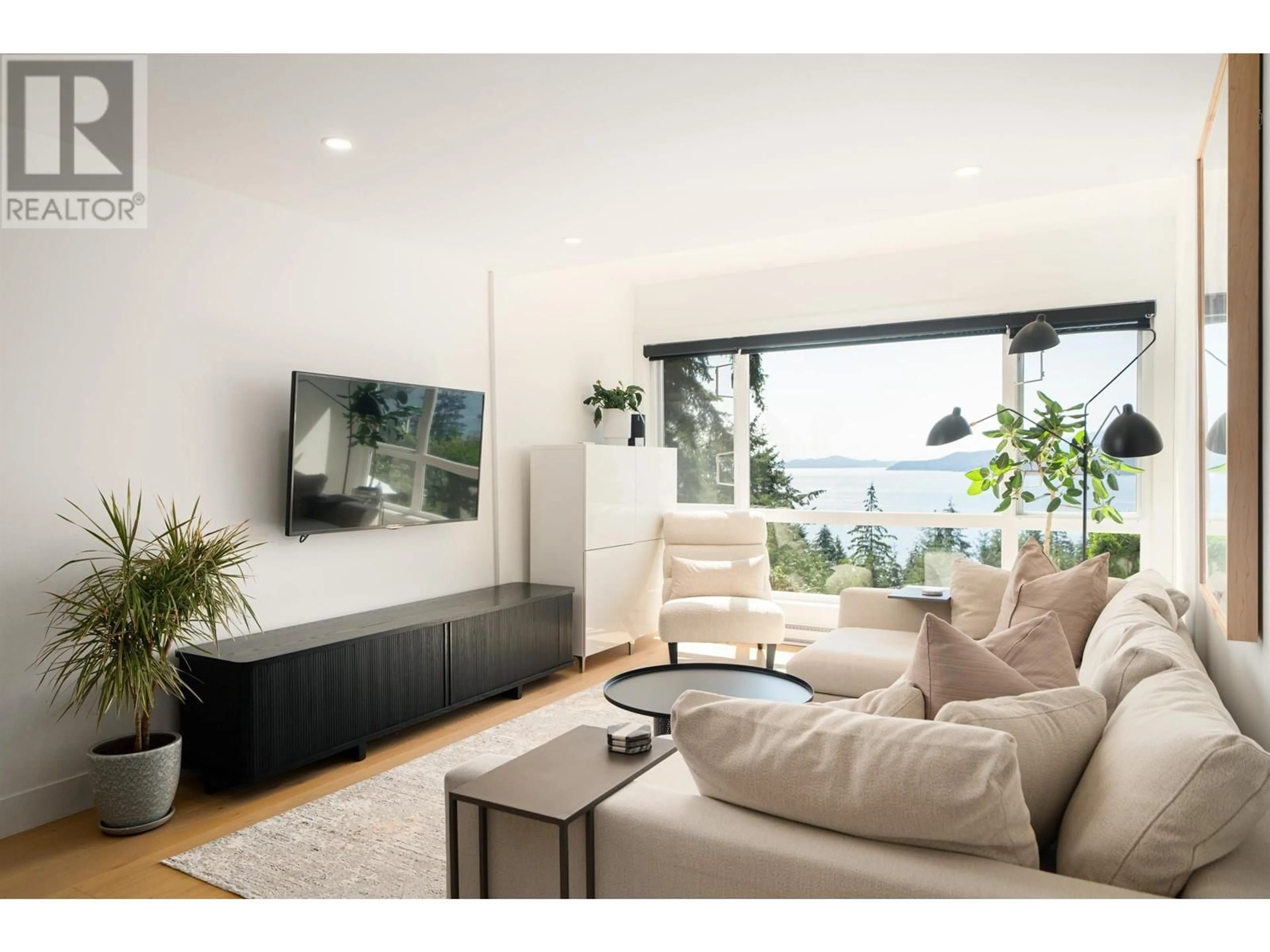 Living room with furniture, wood/laminate floor for 438 CROSSCREEK ROAD, Lions Bay British Columbia V0N2E0