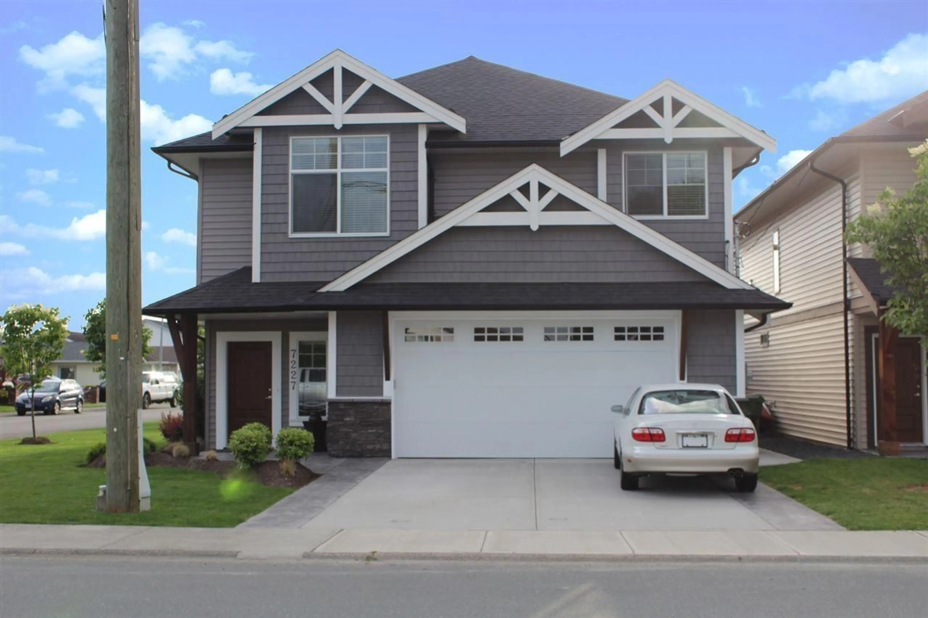 Home with vinyl exterior material, street for 7227 RICHARDSON AVENUE, Sardis British Columbia V2R1H2