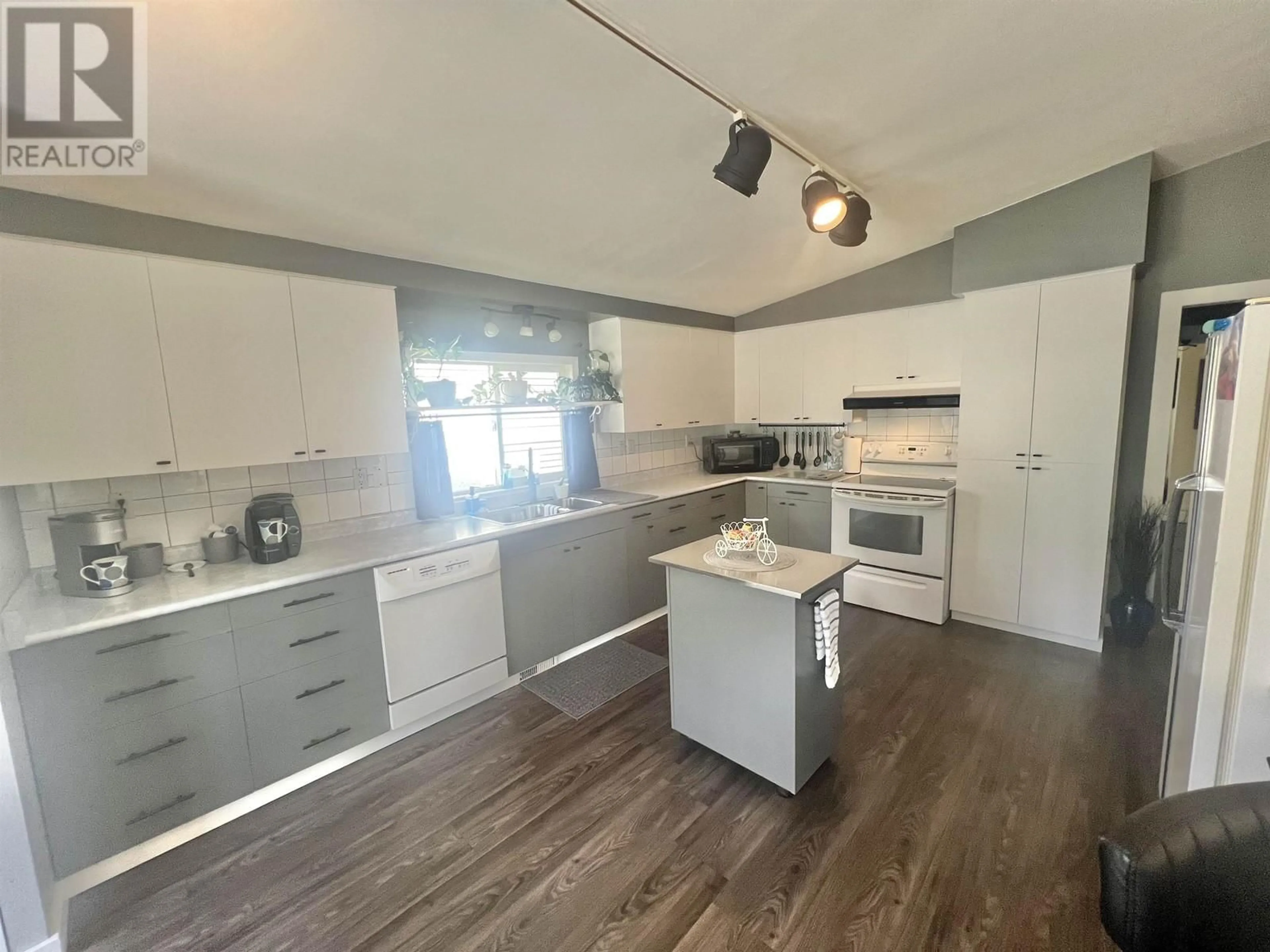 Open concept kitchen, wood/laminate floor for 125 CRESTVIEW DRIVE, Prince Rupert British Columbia V8J2Z4