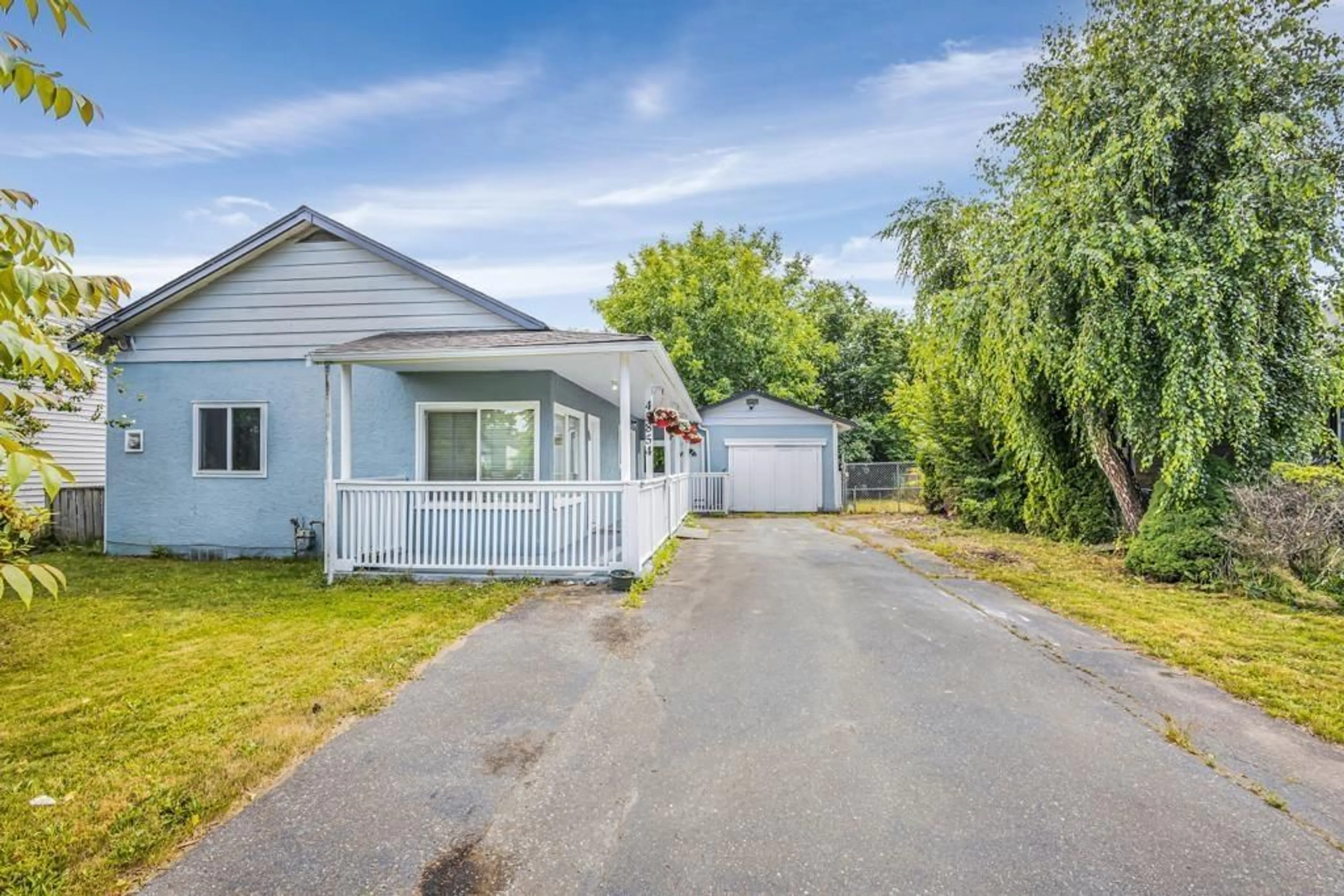 A pic from outside/outdoor area/front of a property/back of a property/a pic from drone, street for 45854 HENLEY AVENUE, Chilliwack British Columbia V2P3J9