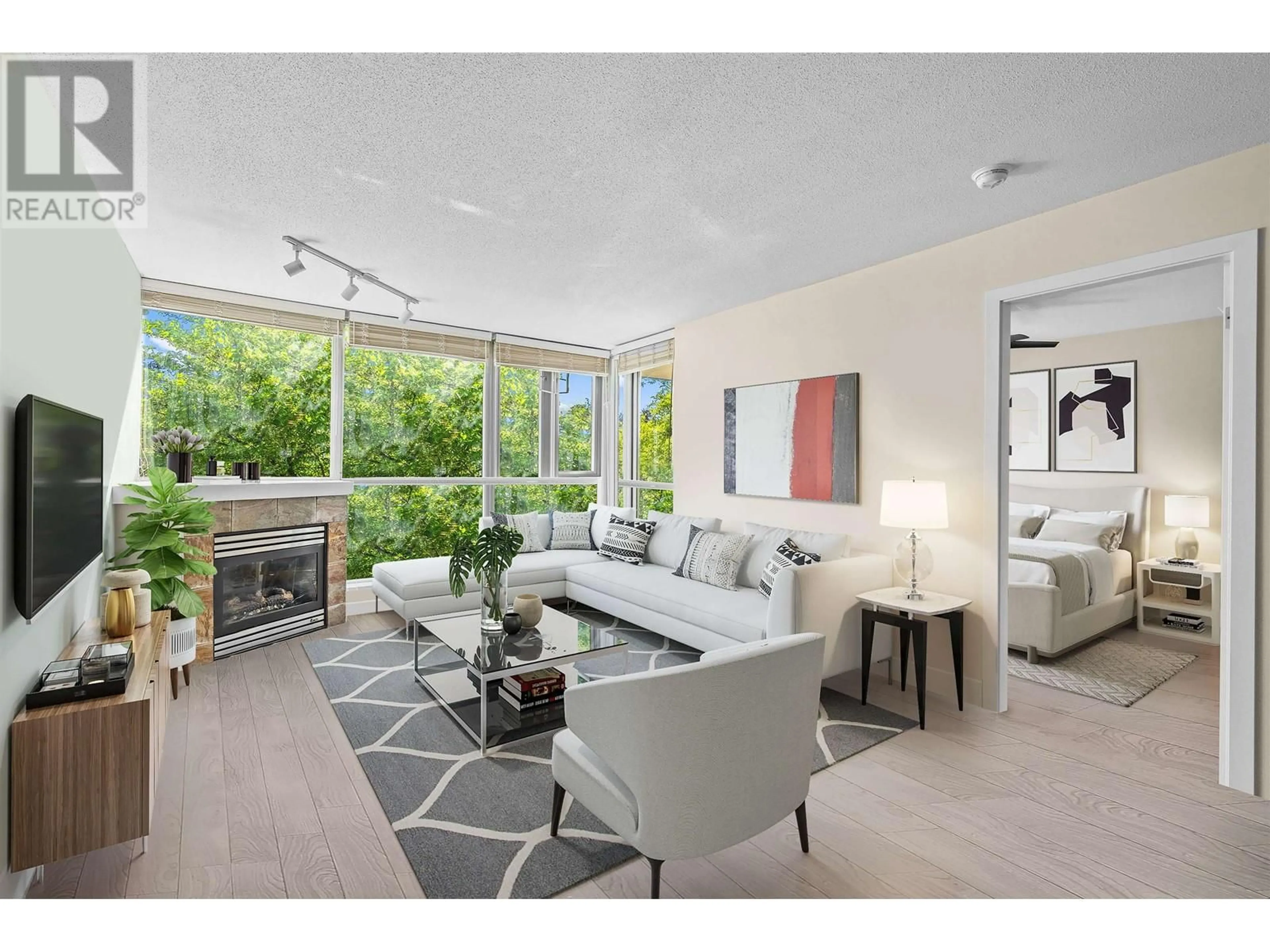 Living room with furniture, unknown for 202 - 235 GUILDFORD WAY, Port Moody British Columbia V3H5L8