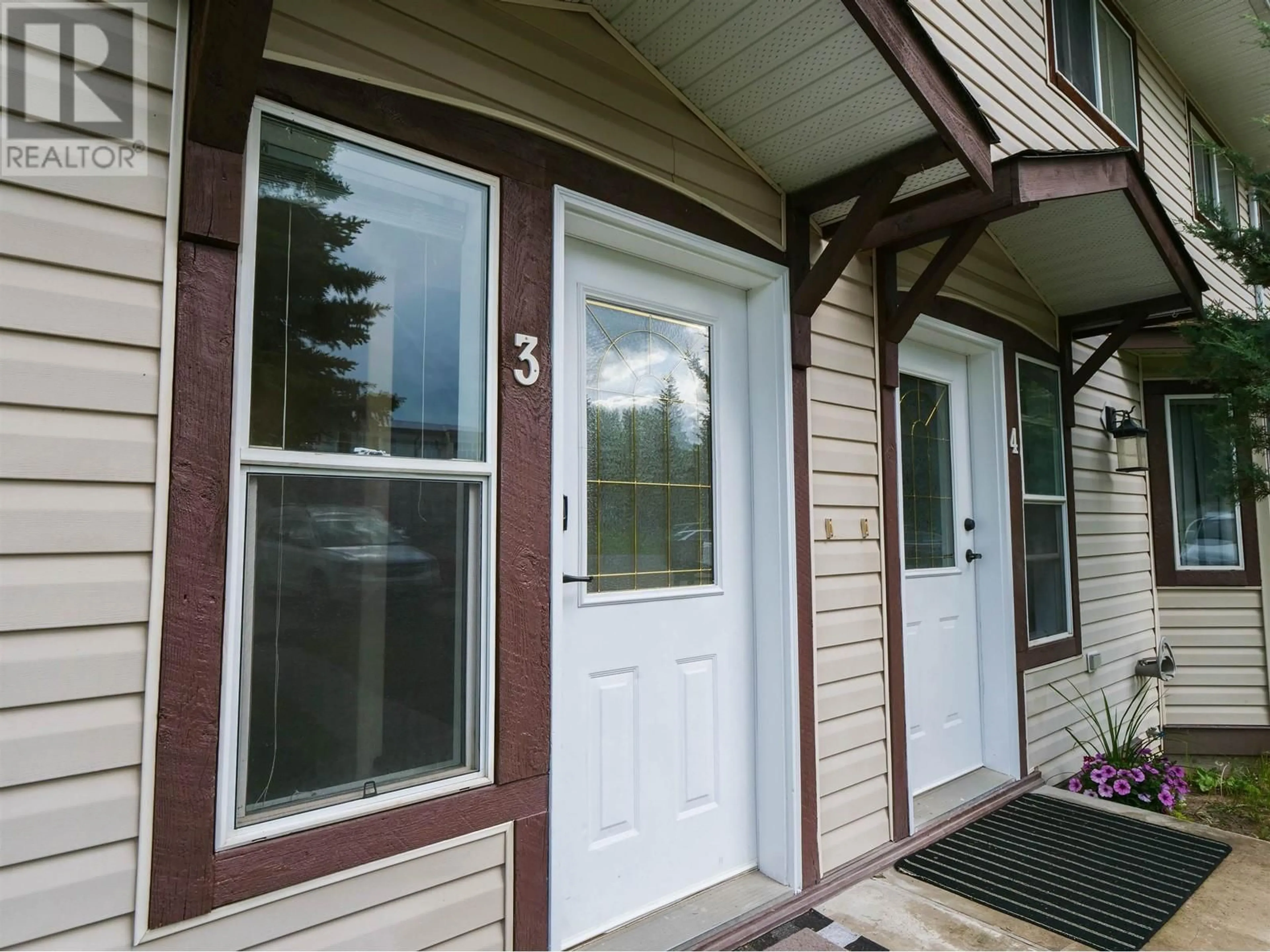 Home with vinyl exterior material, street for 410 PINCHBECK STREET, Quesnel British Columbia V2J6A3