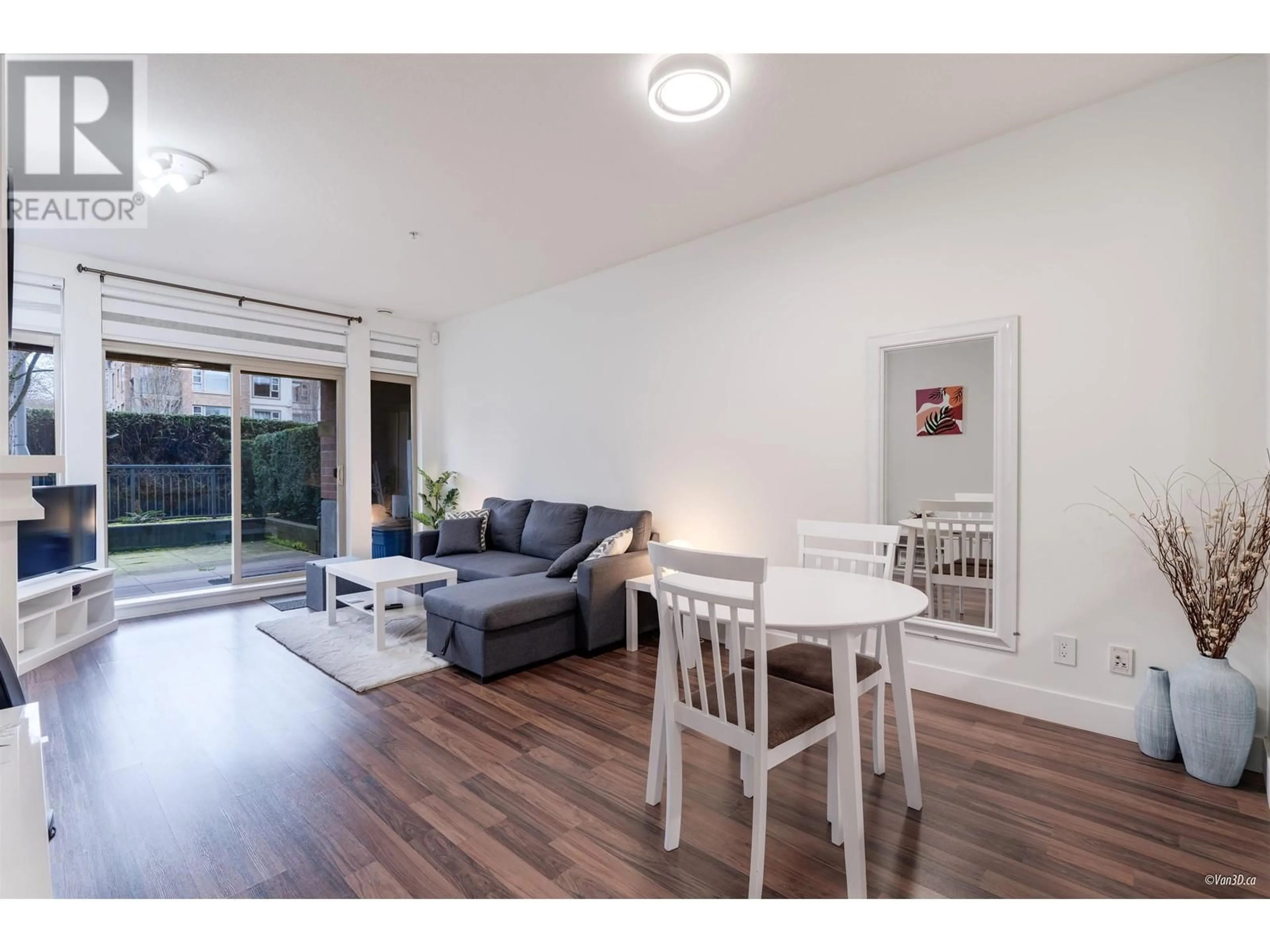 Living room with furniture, wood/laminate floor for 112 - 2280 WESBROOK MALL, Vancouver British Columbia V6T2K3