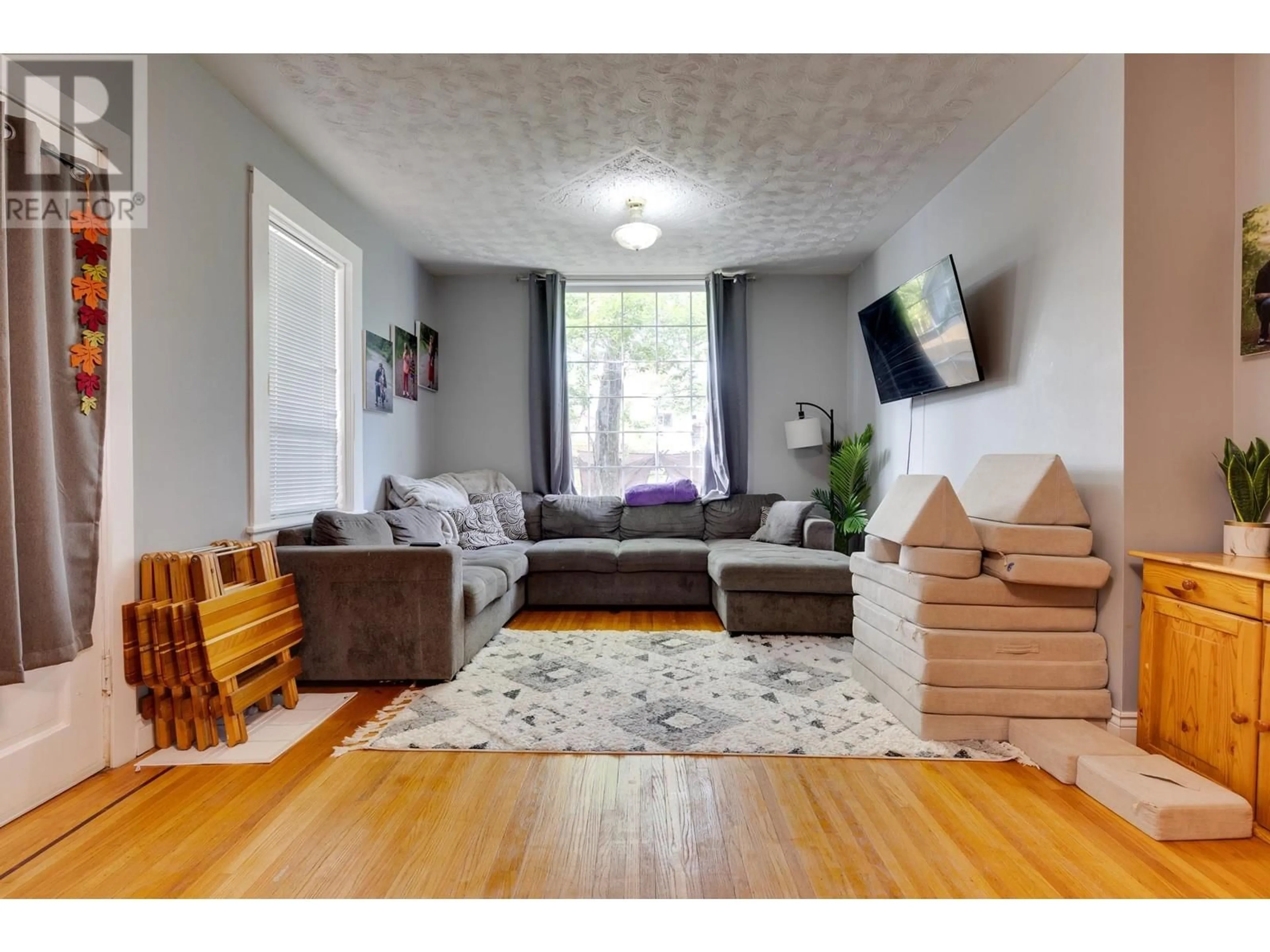 Living room with furniture, wood/laminate floor for 2433 INLANDER STREET, Prince George British Columbia V2L5V8