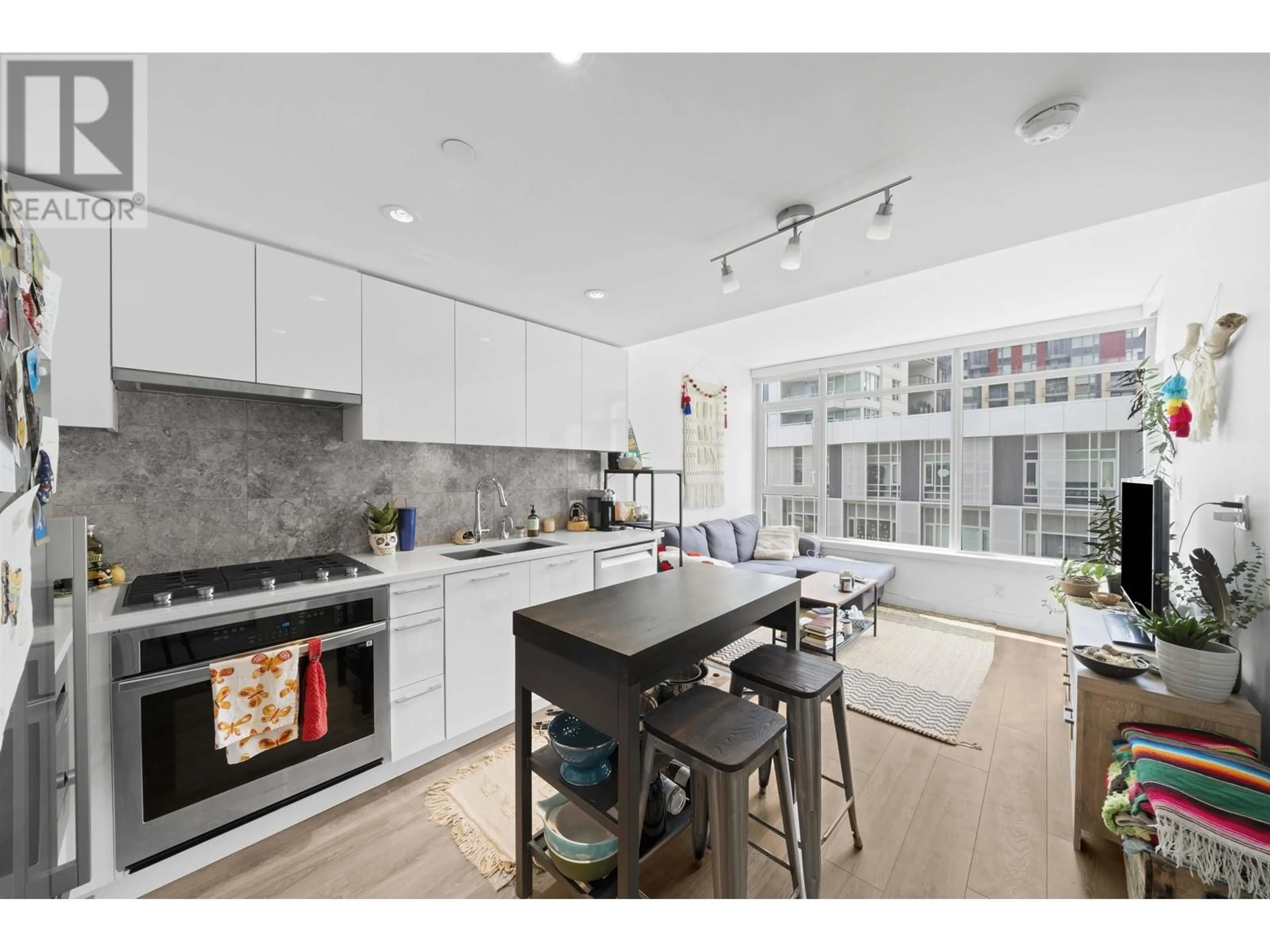 Open concept kitchen, ceramic/tile floor for 509 - 8538 RIVER DISTRICT CROSSING, Vancouver British Columbia V5S0C9