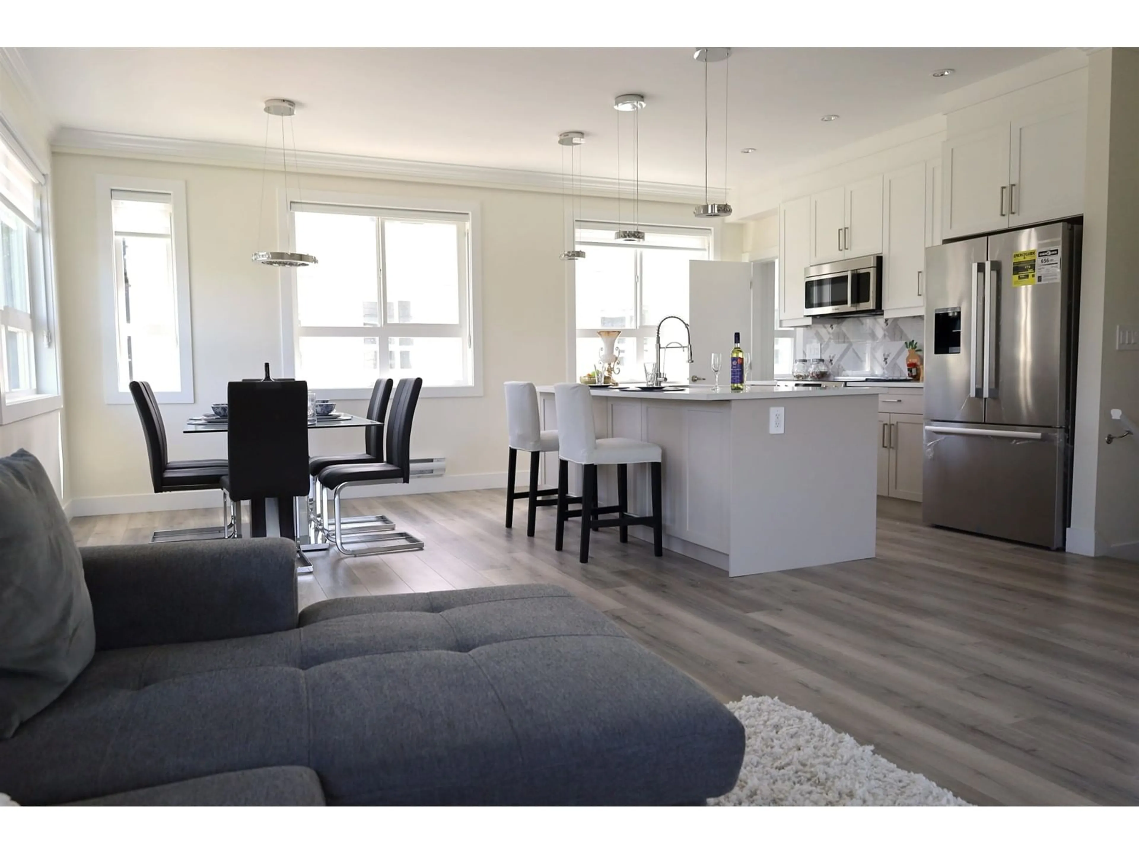 Open concept kitchen, wood/laminate floor for 13 - 8181 135A, Surrey British Columbia V3W3N8