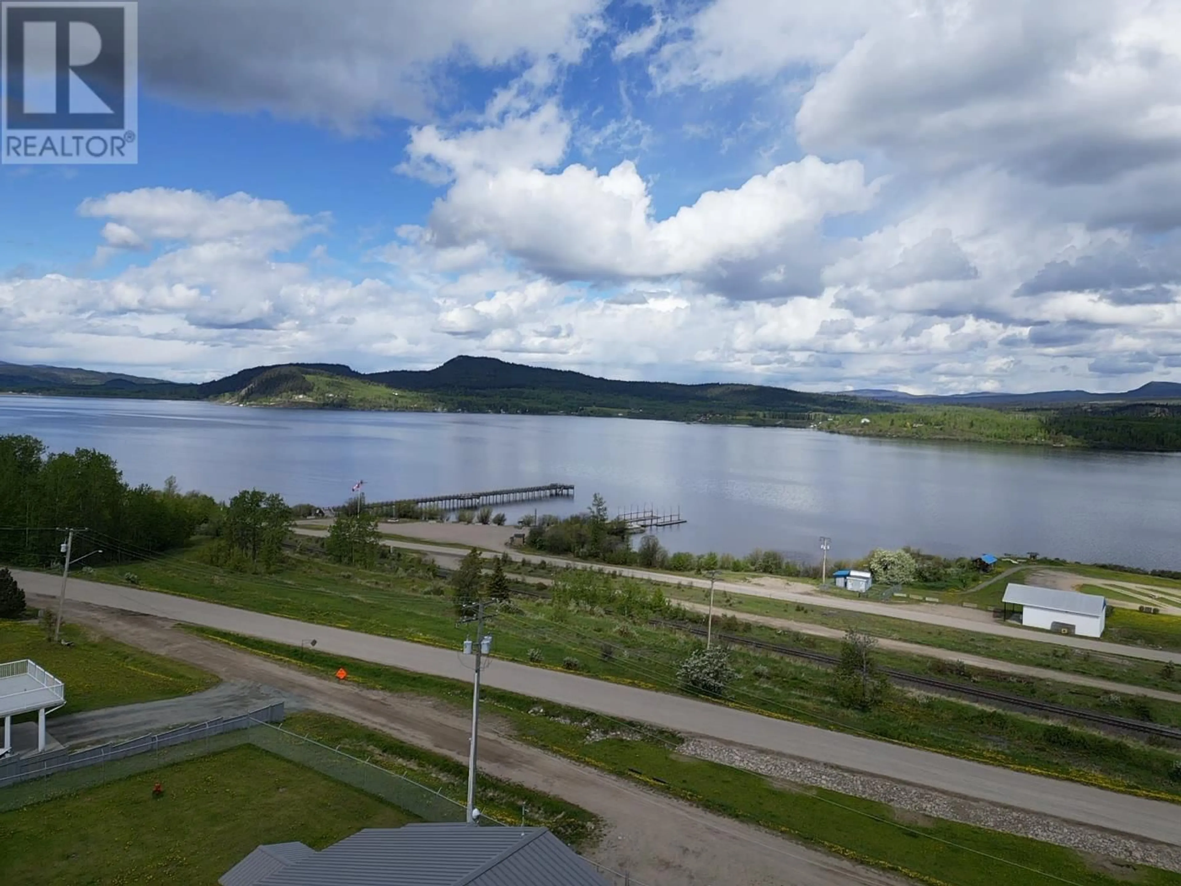 A pic from outside/outdoor area/front of a property/back of a property/a pic from drone, water/lake/river/ocean view for 316 TUNASA CRESCENT, Fraser Lake British Columbia V0J1S0