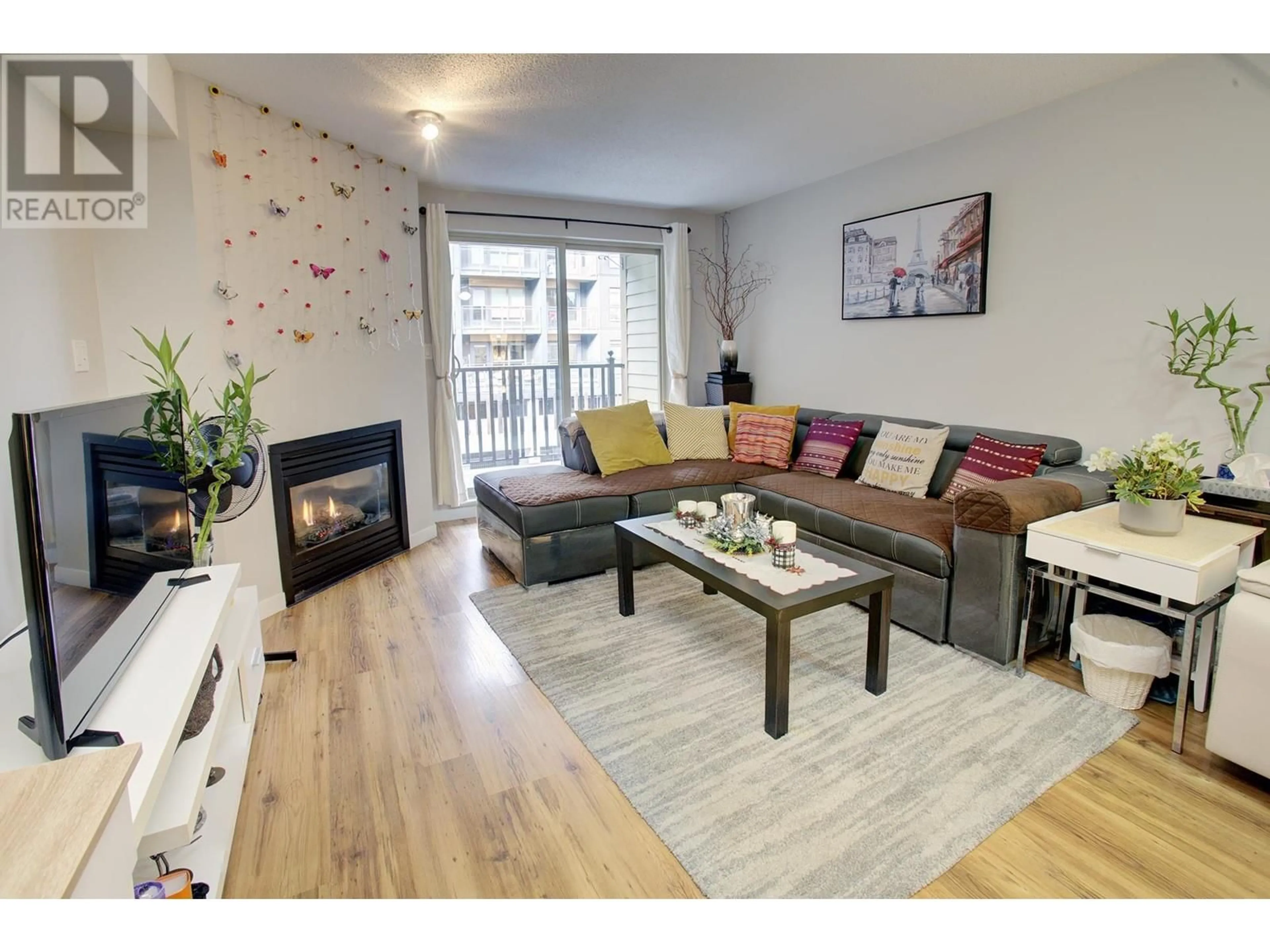 Living room with furniture, wood/laminate floor for 207 - 38003 SECOND AVENUE, Squamish British Columbia V8B0B8