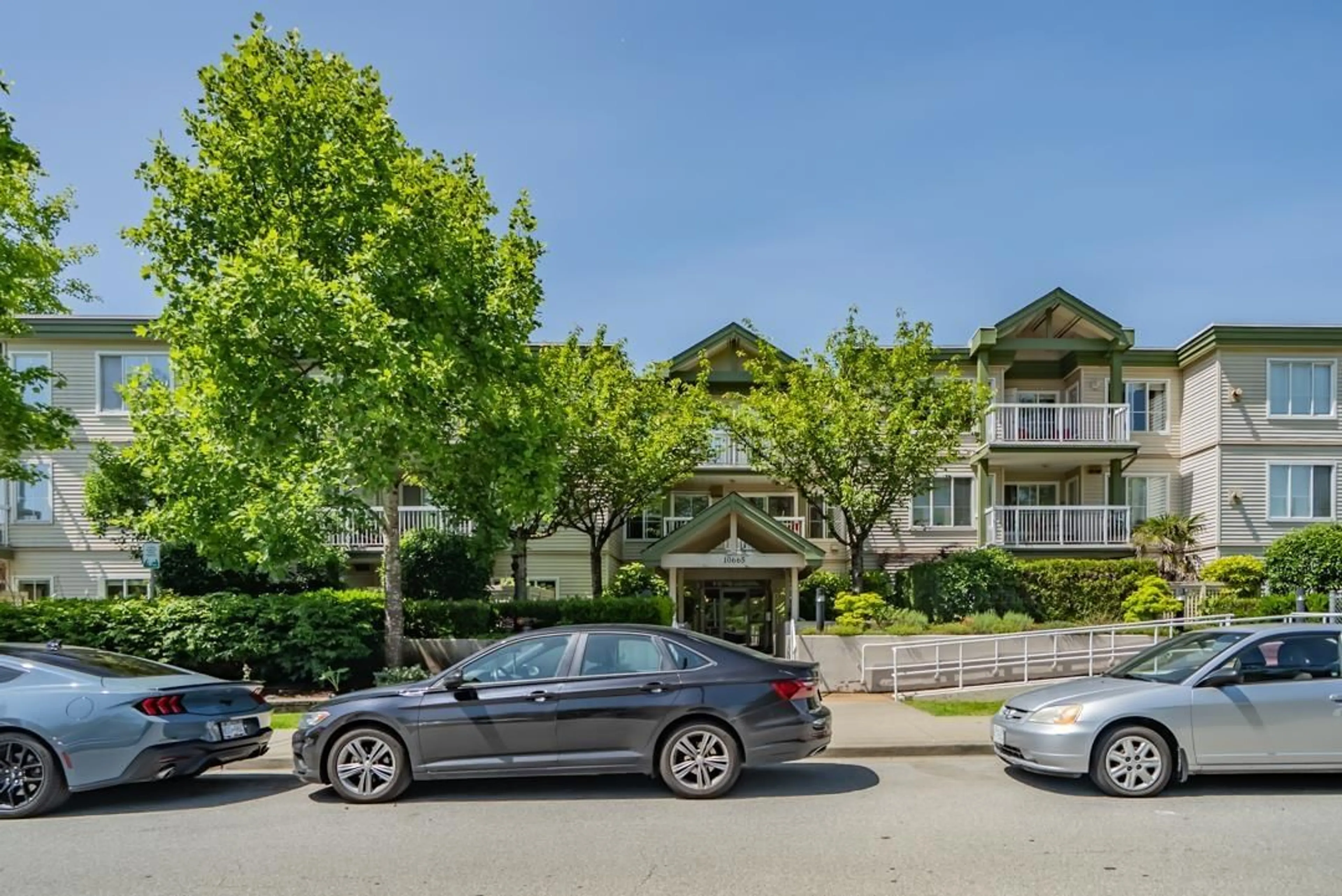 A pic from outside/outdoor area/front of a property/back of a property/a pic from drone, mountain view for 210 - 10665 139, Surrey British Columbia V3T4L8