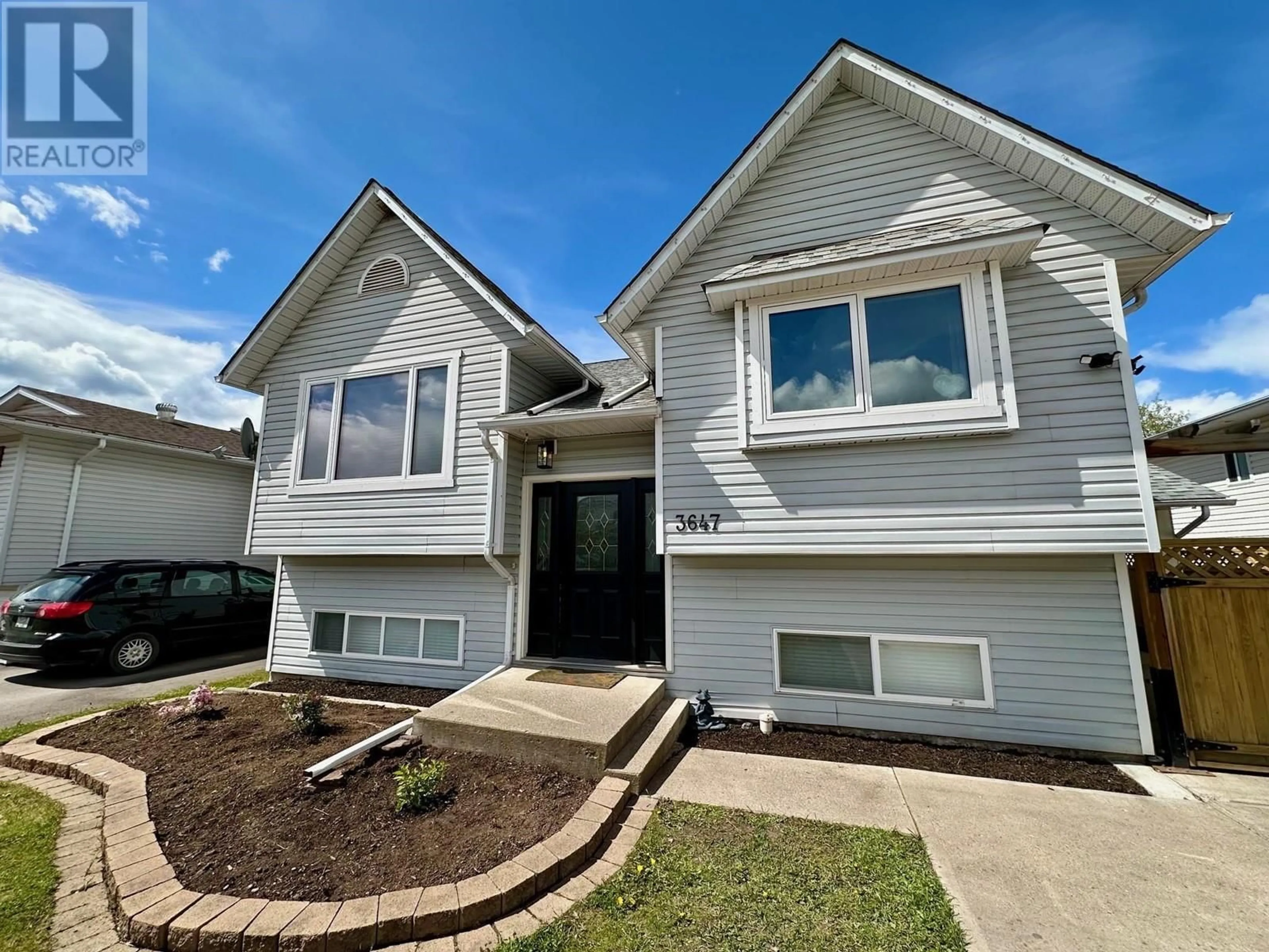 Home with vinyl exterior material, street for 3647 14TH AVENUE, Smithers British Columbia V0J2N0