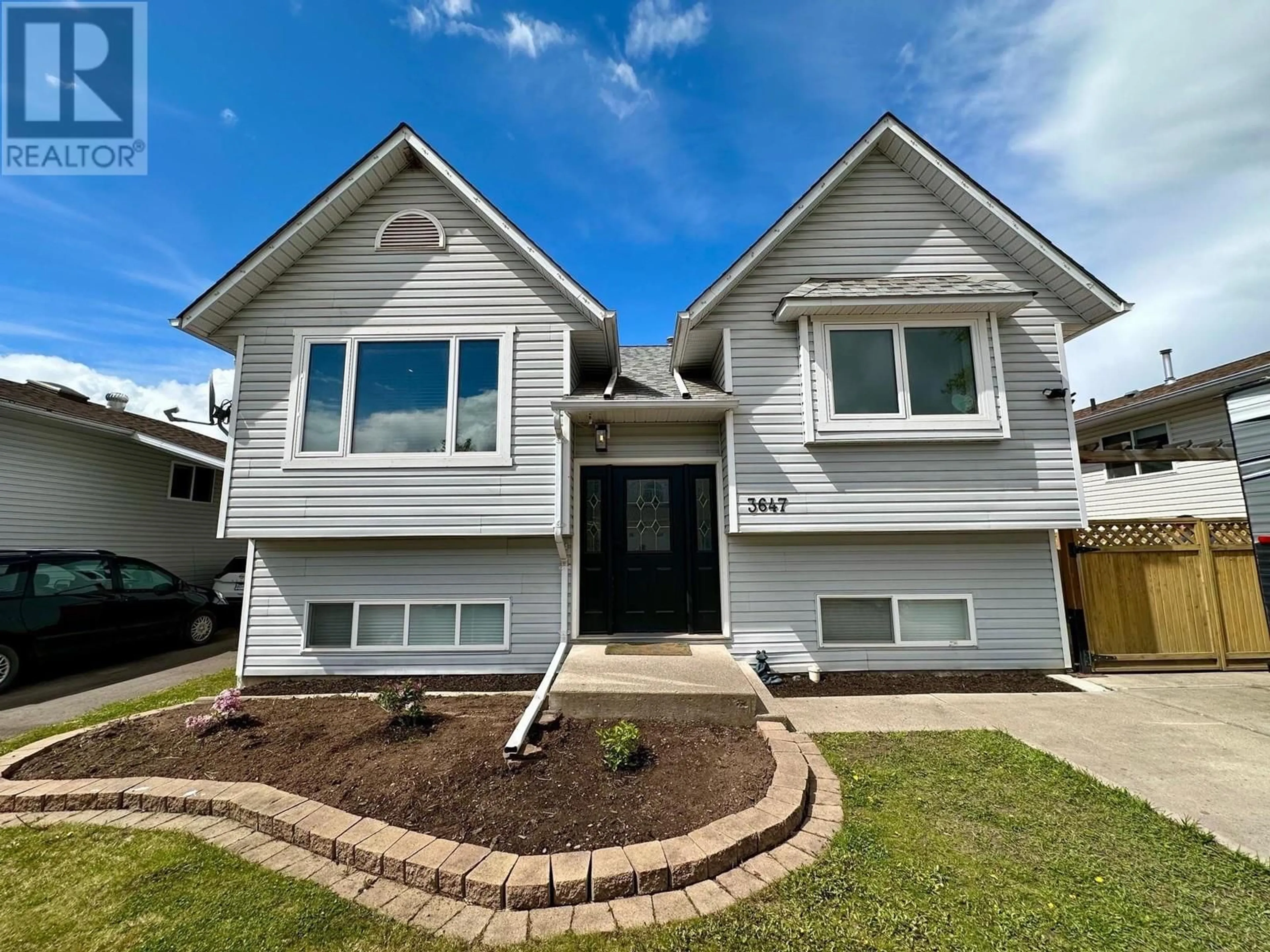 Home with vinyl exterior material, street for 3647 14TH AVENUE, Smithers British Columbia V0J2N0