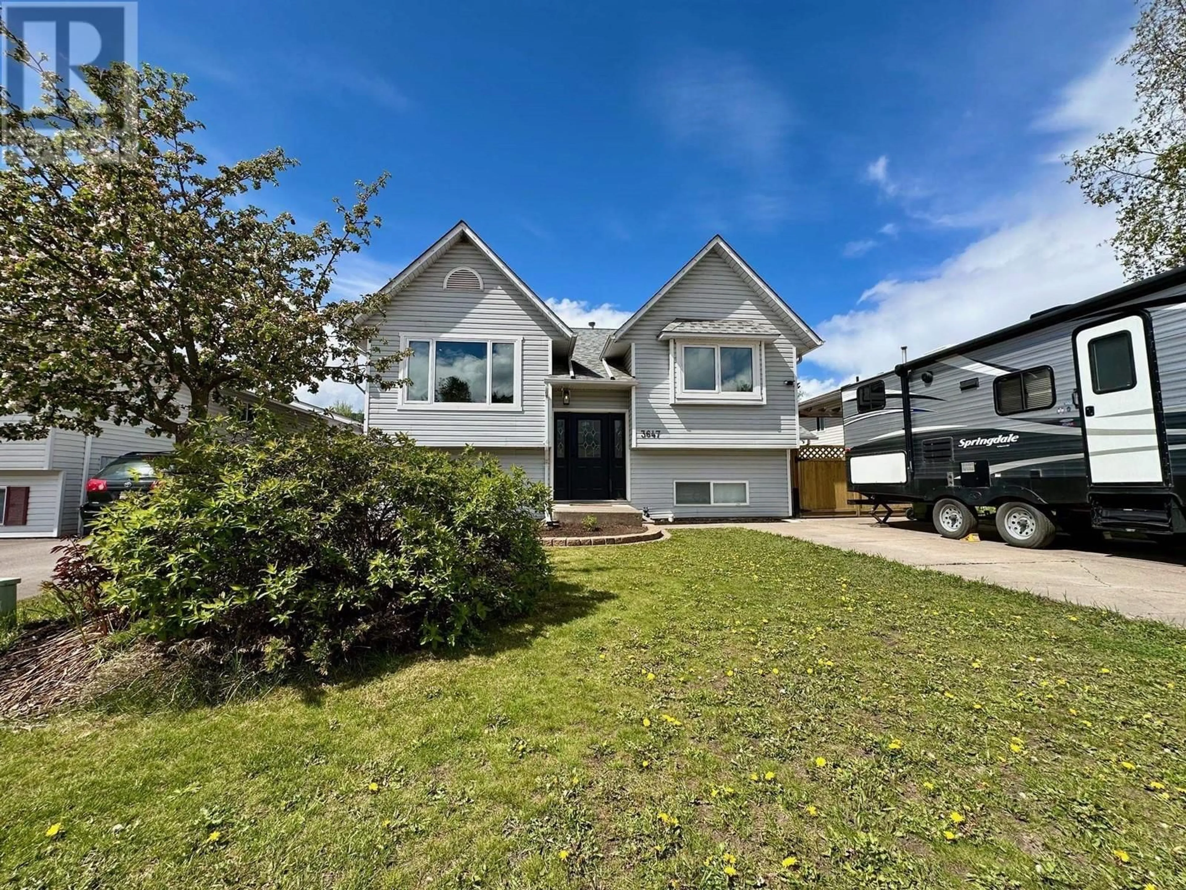Home with vinyl exterior material, street for 3647 14TH AVENUE, Smithers British Columbia V0J2N0