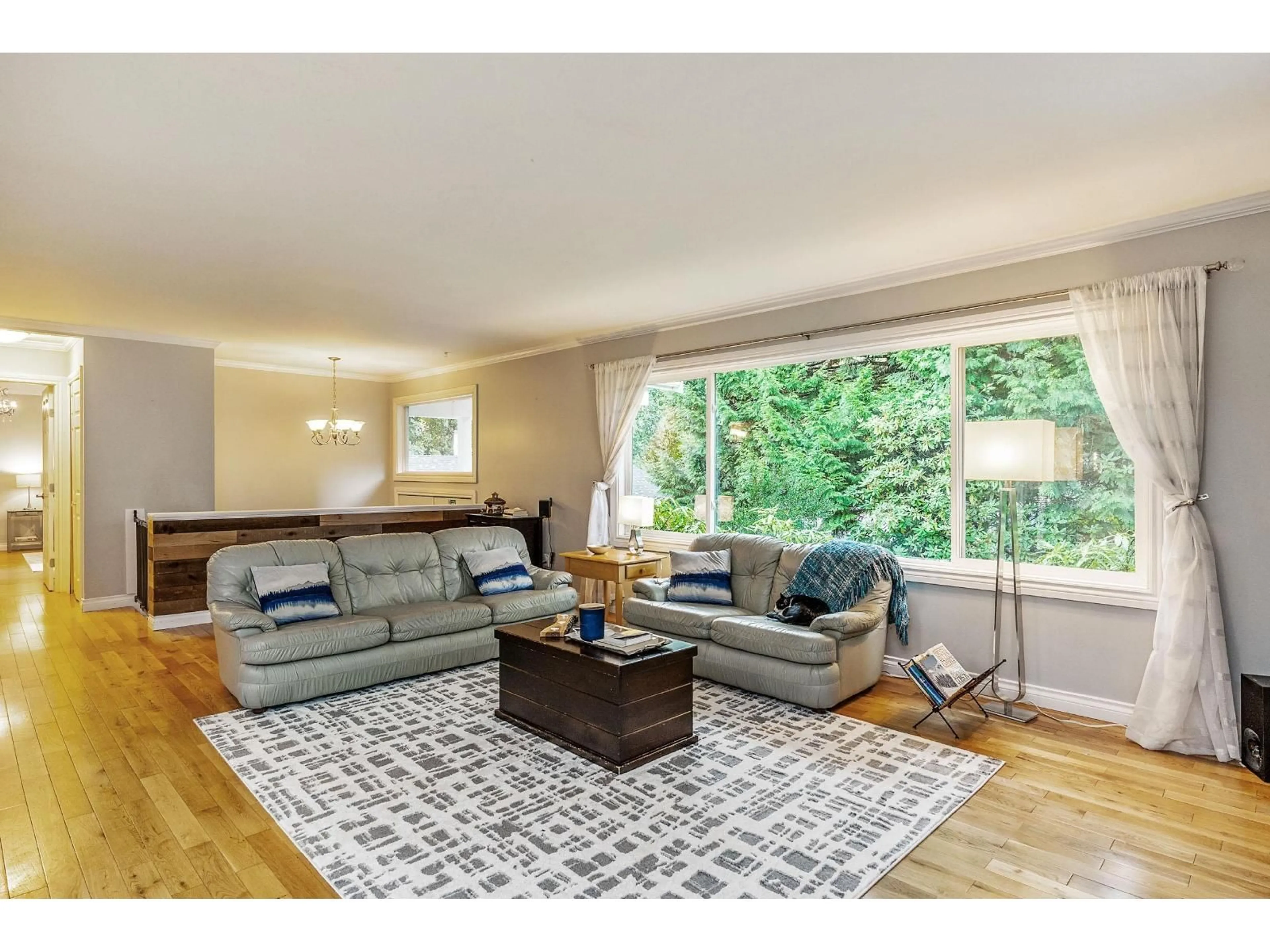 Living room with furniture, wood/laminate floor for 16362 14A, Surrey British Columbia V4A1J4