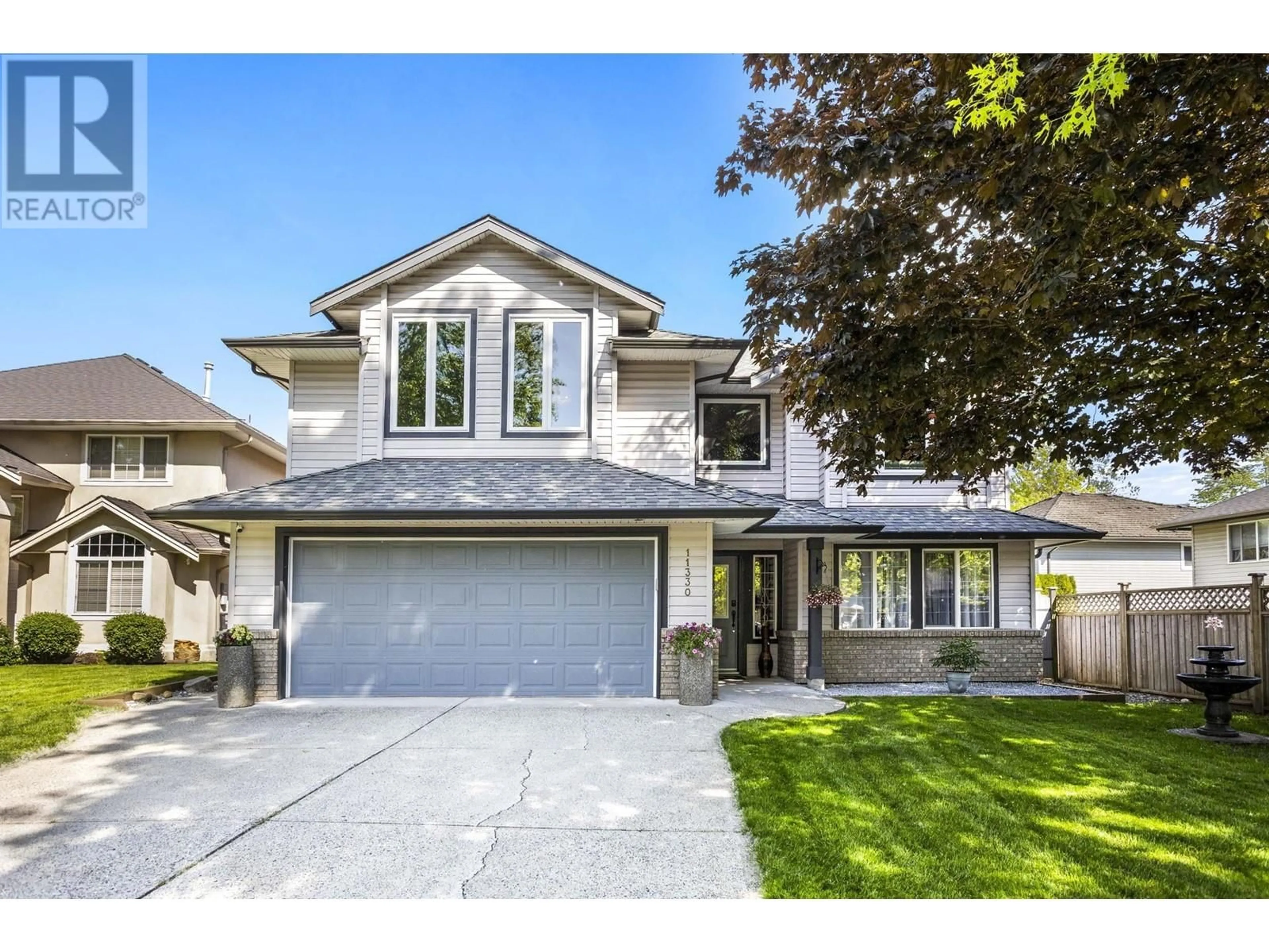 Home with vinyl exterior material, street for 11330 238 STREET, Maple Ridge British Columbia V2W1V4