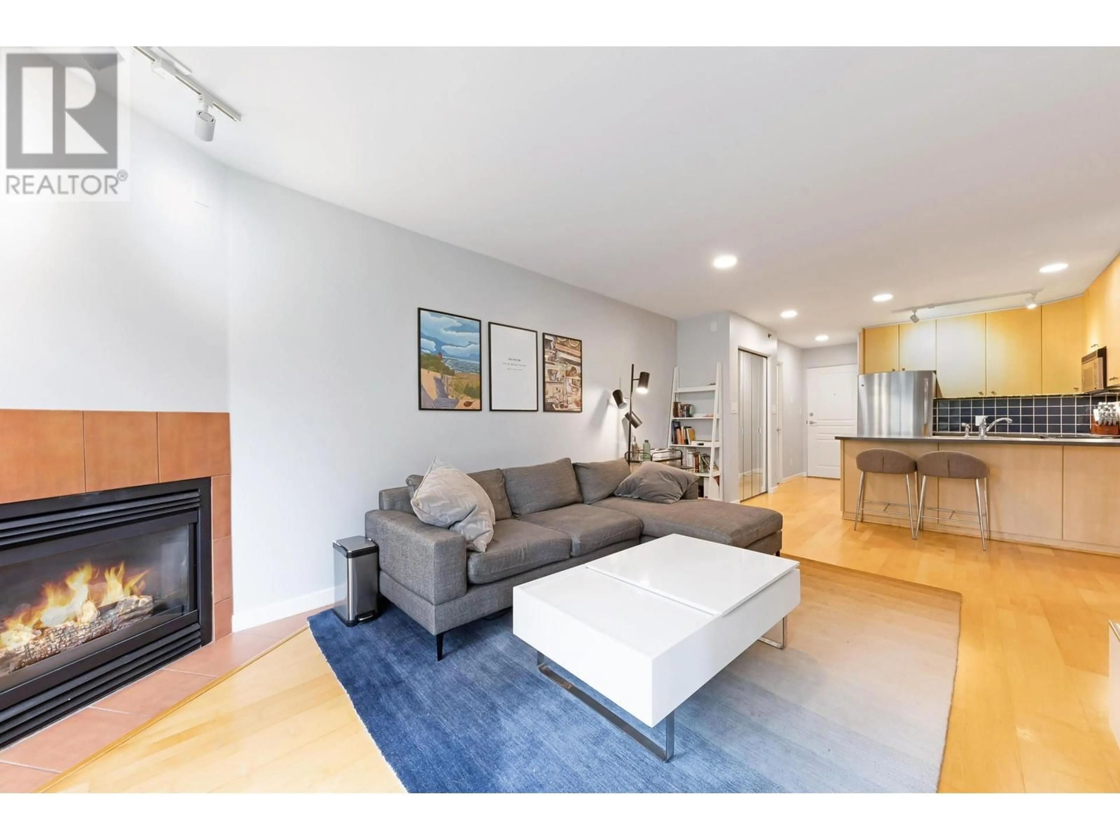 Living room with furniture, wood/laminate floor for 508 - 819 HAMILTON STREET, Vancouver British Columbia V6B6M2