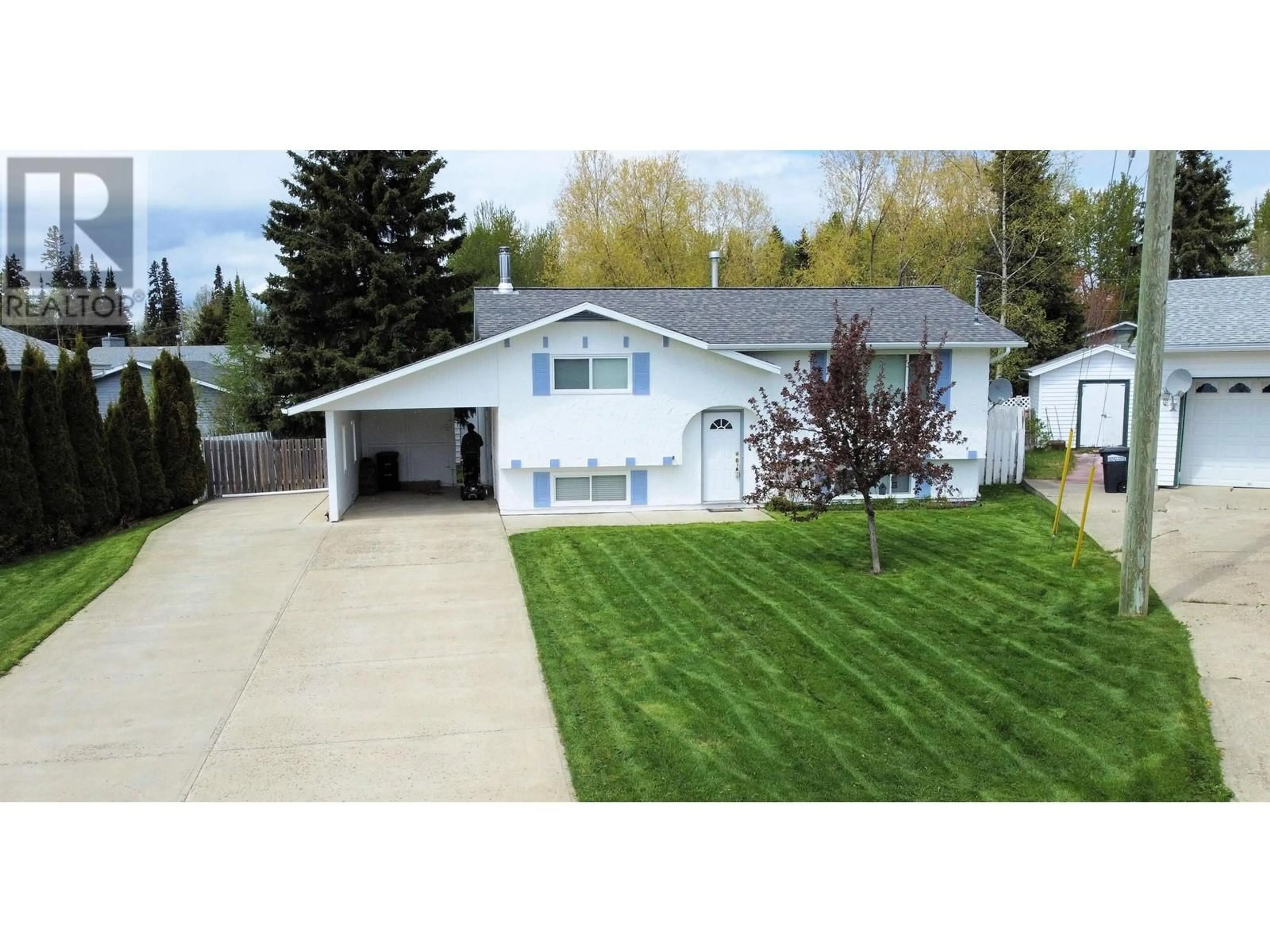 Home with vinyl exterior material, street for 310 CROOKED RIVER CRESCENT, Mackenzie British Columbia V0J2C0