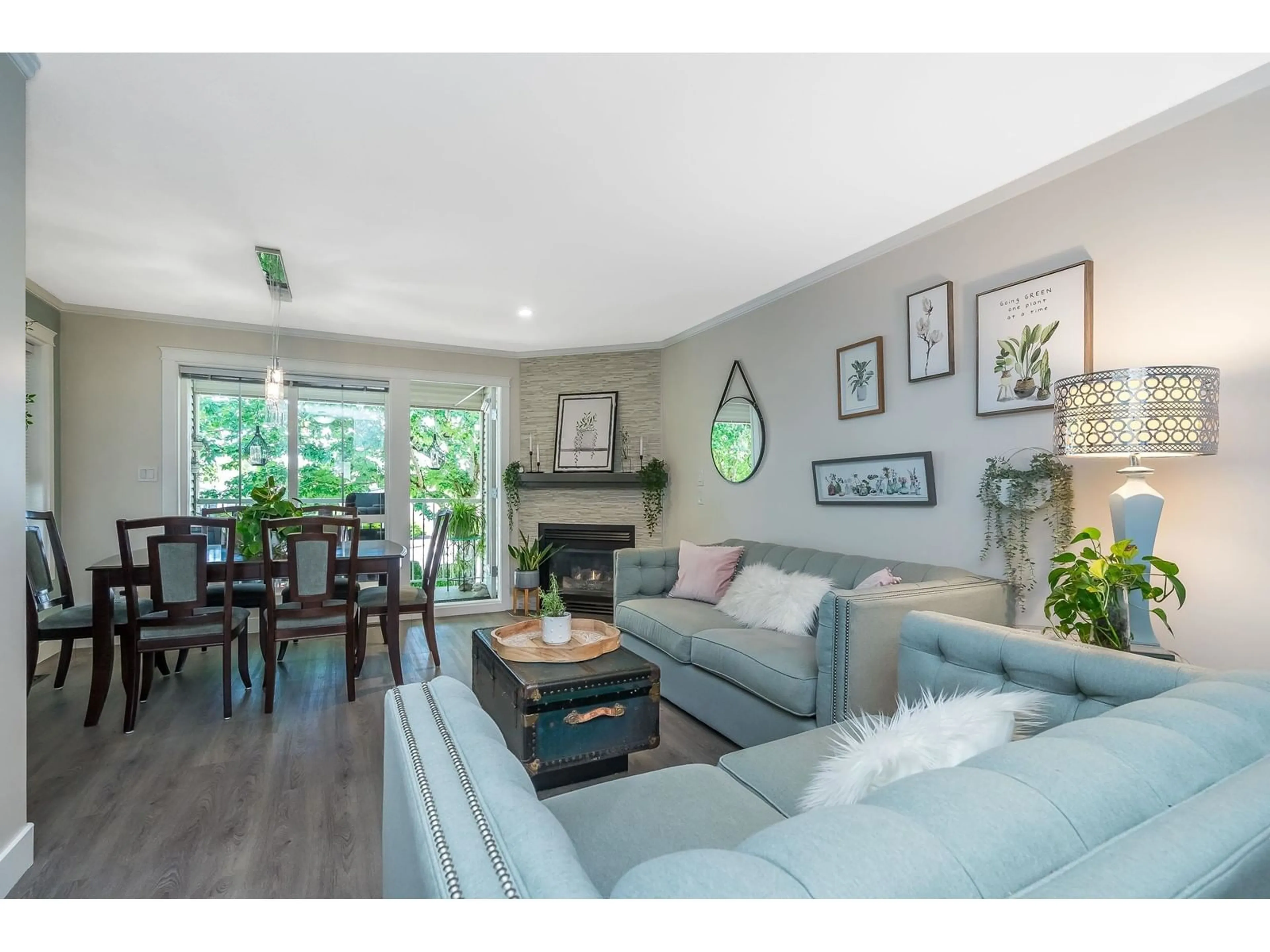 Living room with furniture, wood/laminate floor for 18616 65, Surrey British Columbia V3S8Z9