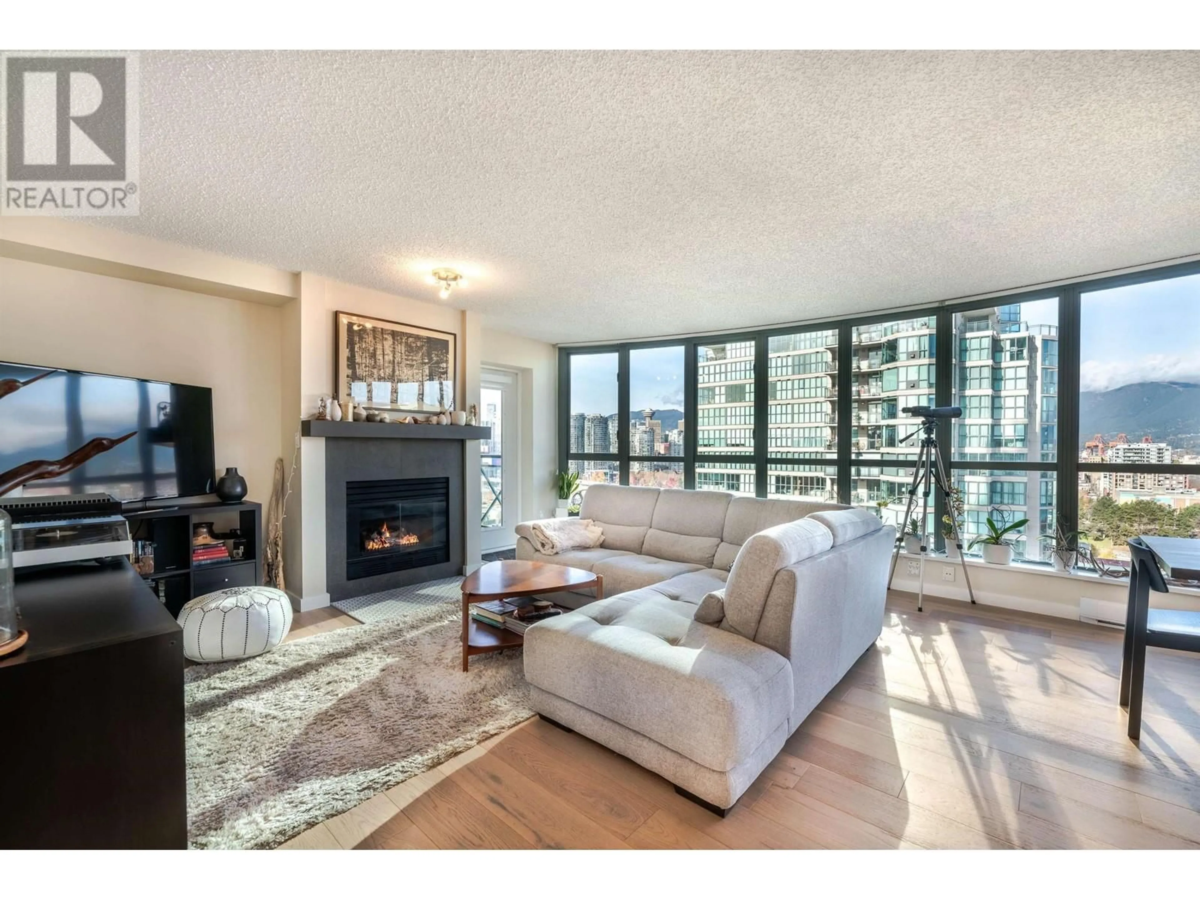 Living room with furniture, wood/laminate floor for 1703 - 1188 QUEBEC STREET, Vancouver British Columbia V6A4B3