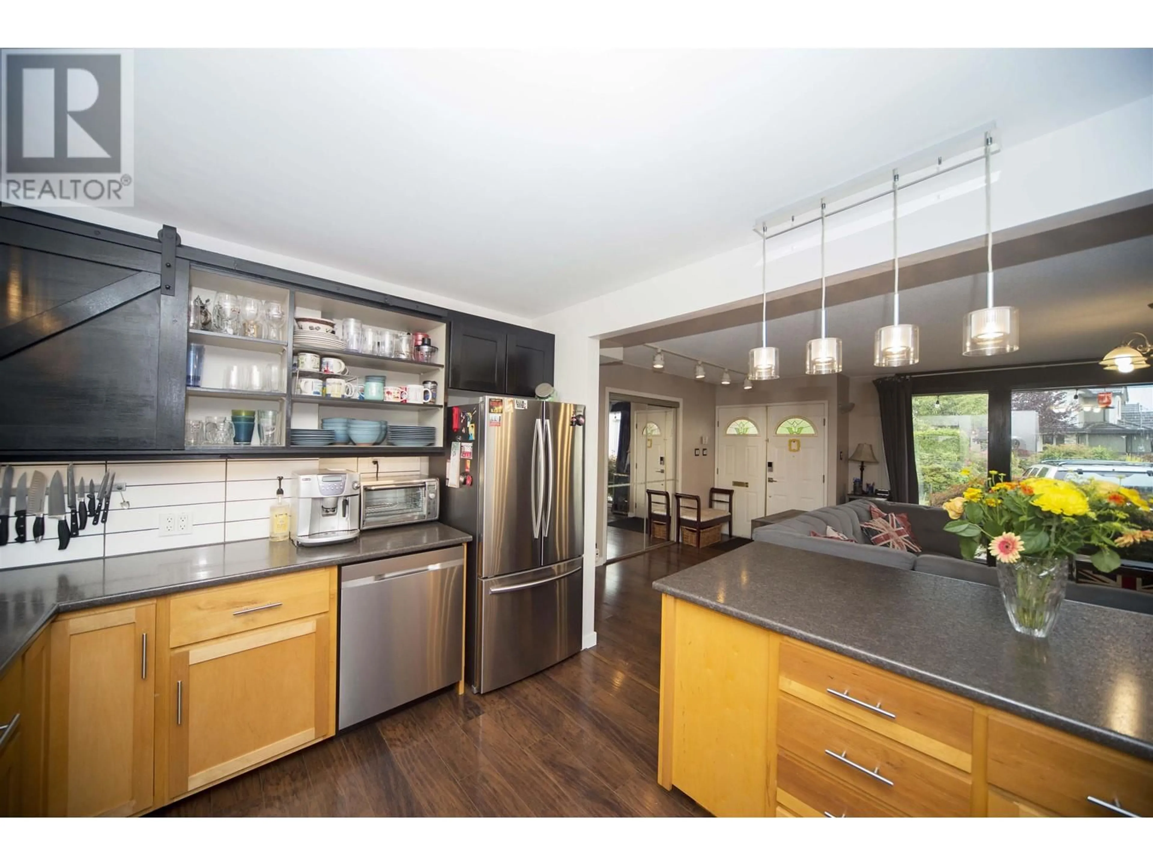 Open concept kitchen, wood/laminate floor for 8660 BAIRDMORE CRESCENT, Richmond British Columbia V7C1M7