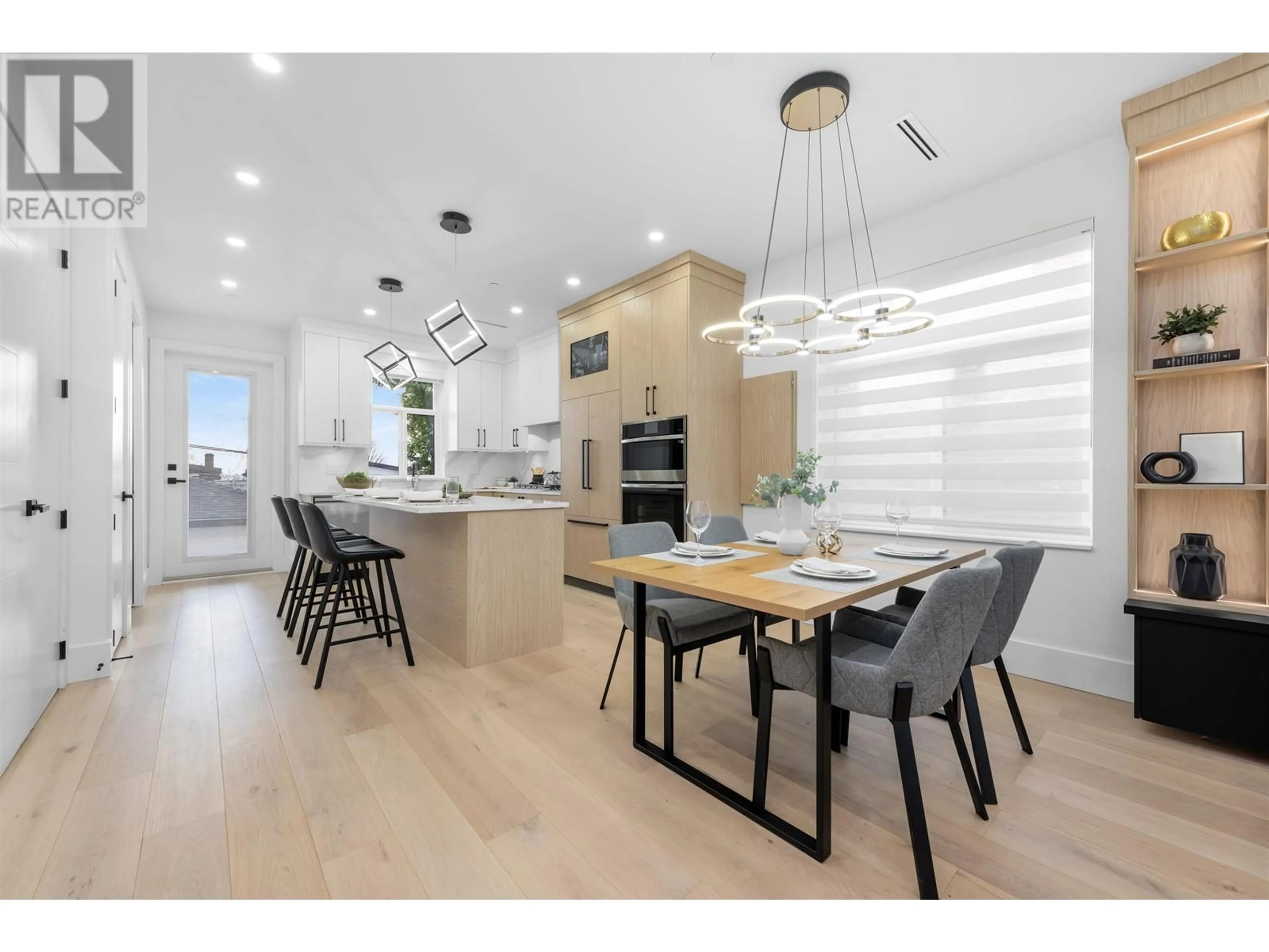 Open concept kitchen, wood/laminate floor for 670 64 AVENUE, Vancouver British Columbia V5X2N2