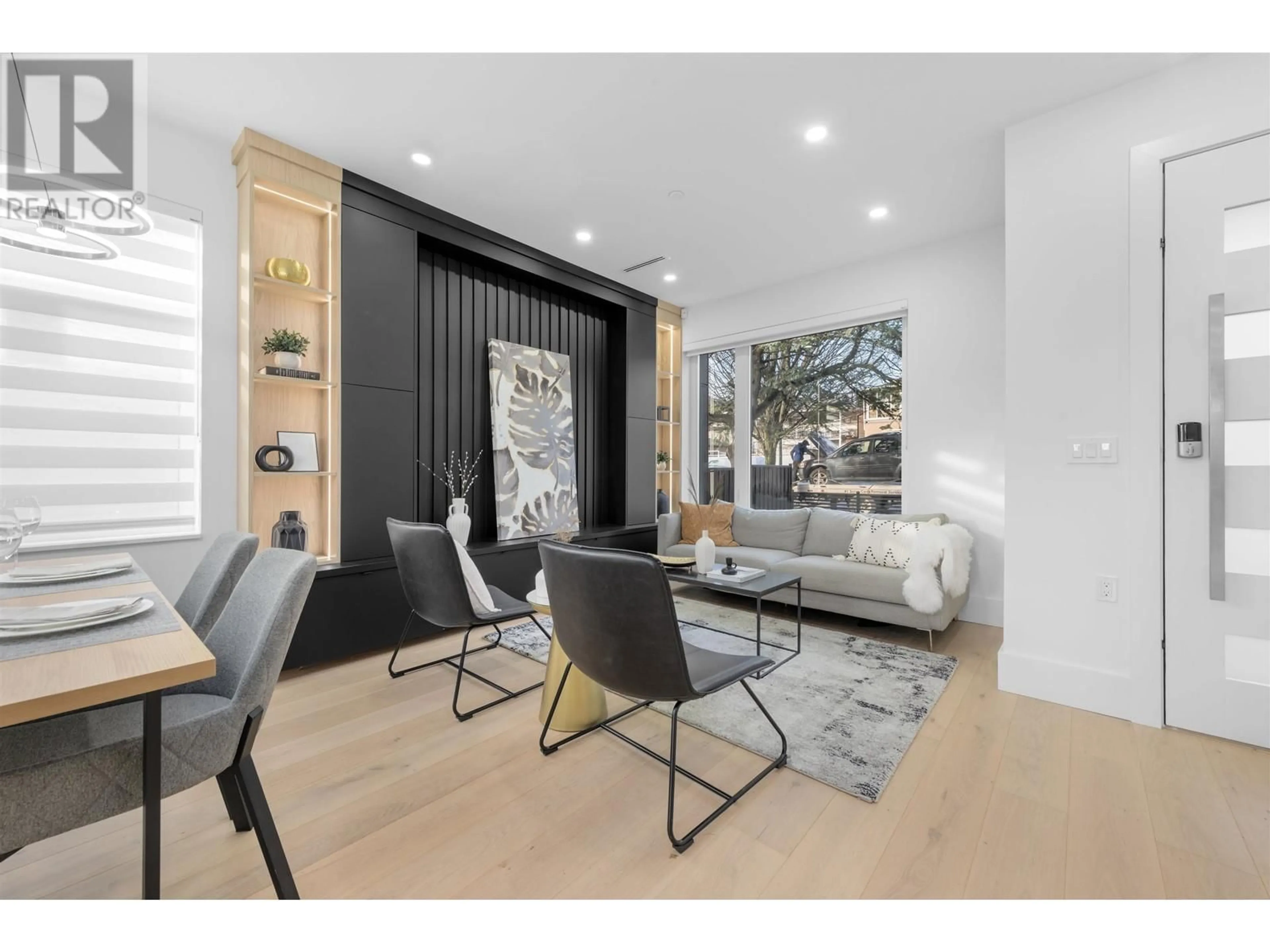 Living room with furniture, wood/laminate floor for 670 64 AVENUE, Vancouver British Columbia V5X2N2