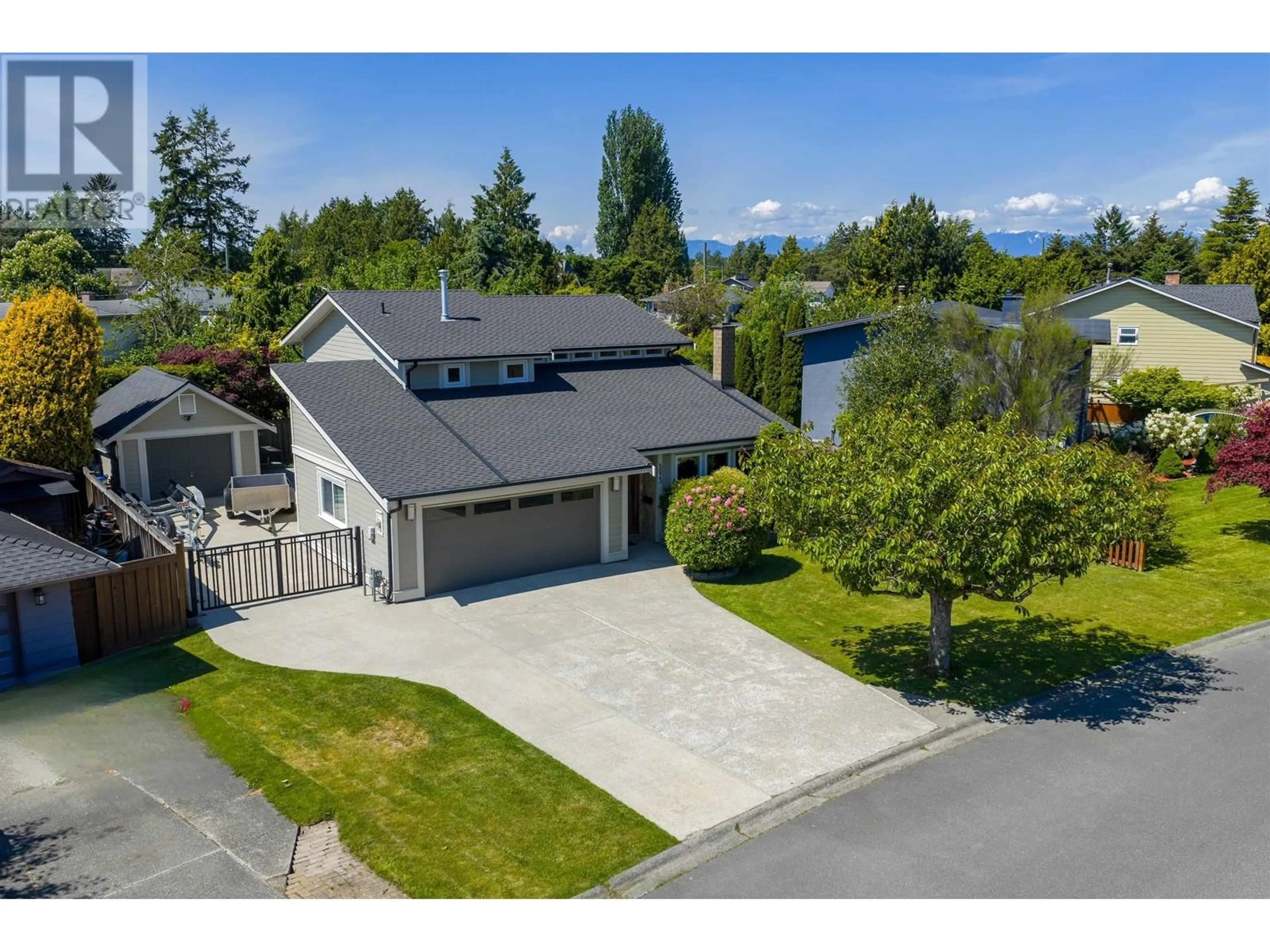 A pic from outside/outdoor area/front of a property/back of a property/a pic from drone, street for 5023 56 STREET, Ladner British Columbia V4K3C3