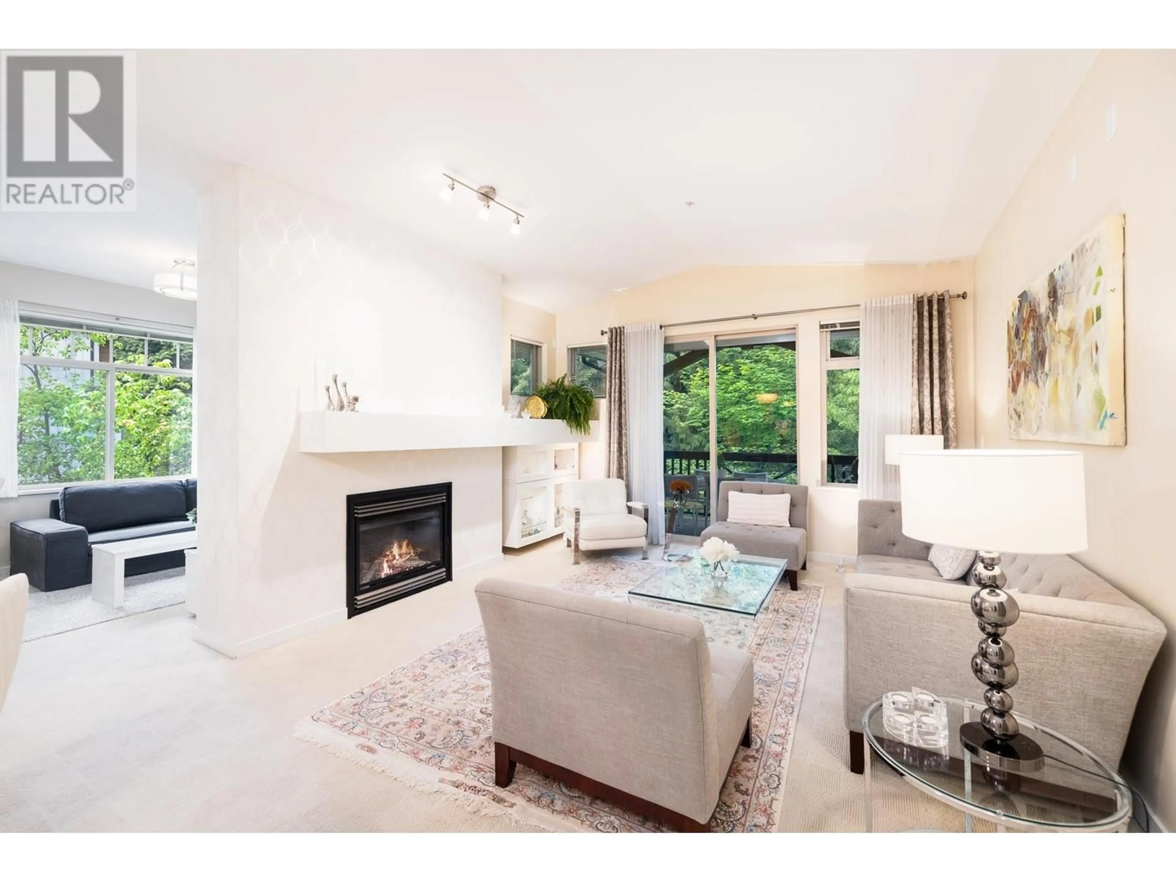 Living room with furniture, ceramic/tile floor for 202 - 3125 CAPILANO CRESCENT, North Vancouver British Columbia V7R4X5