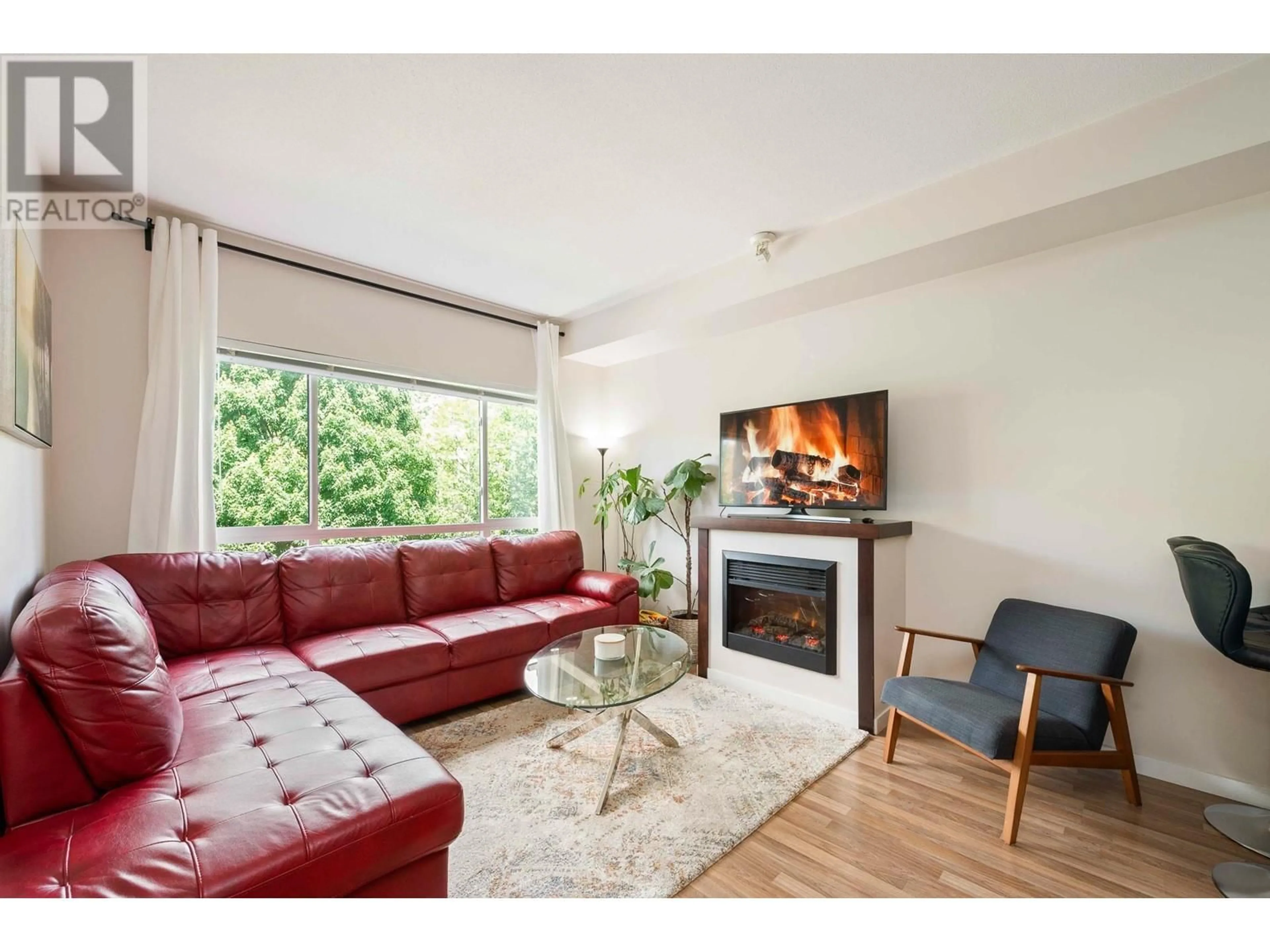 Living room with furniture, wood/laminate floor for 317 - 2478 WELCHER AVENUE, Port Coquitlam British Columbia V3C0A6