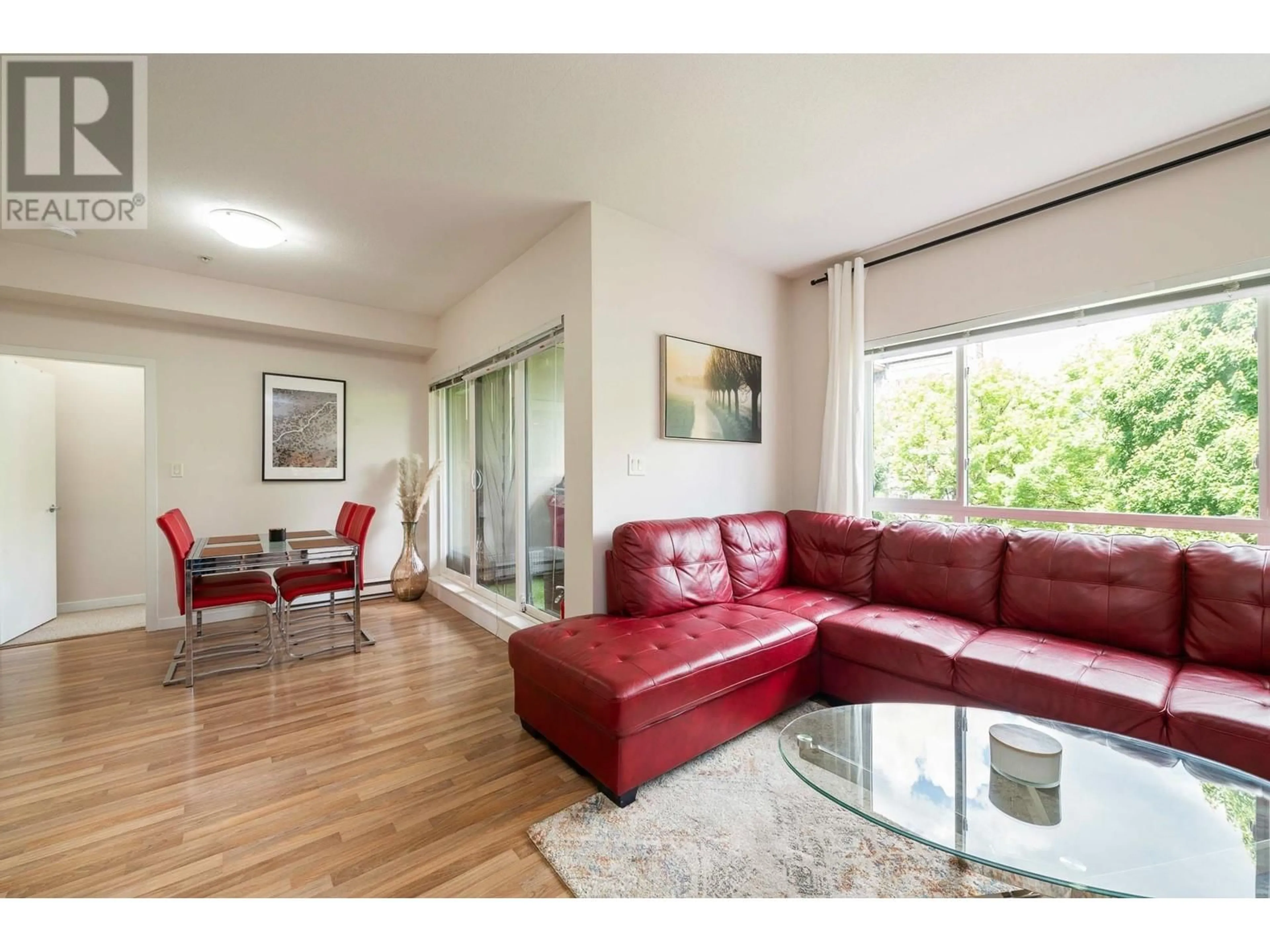 Living room with furniture, wood/laminate floor for 317 - 2478 WELCHER AVENUE, Port Coquitlam British Columbia V3C0A6