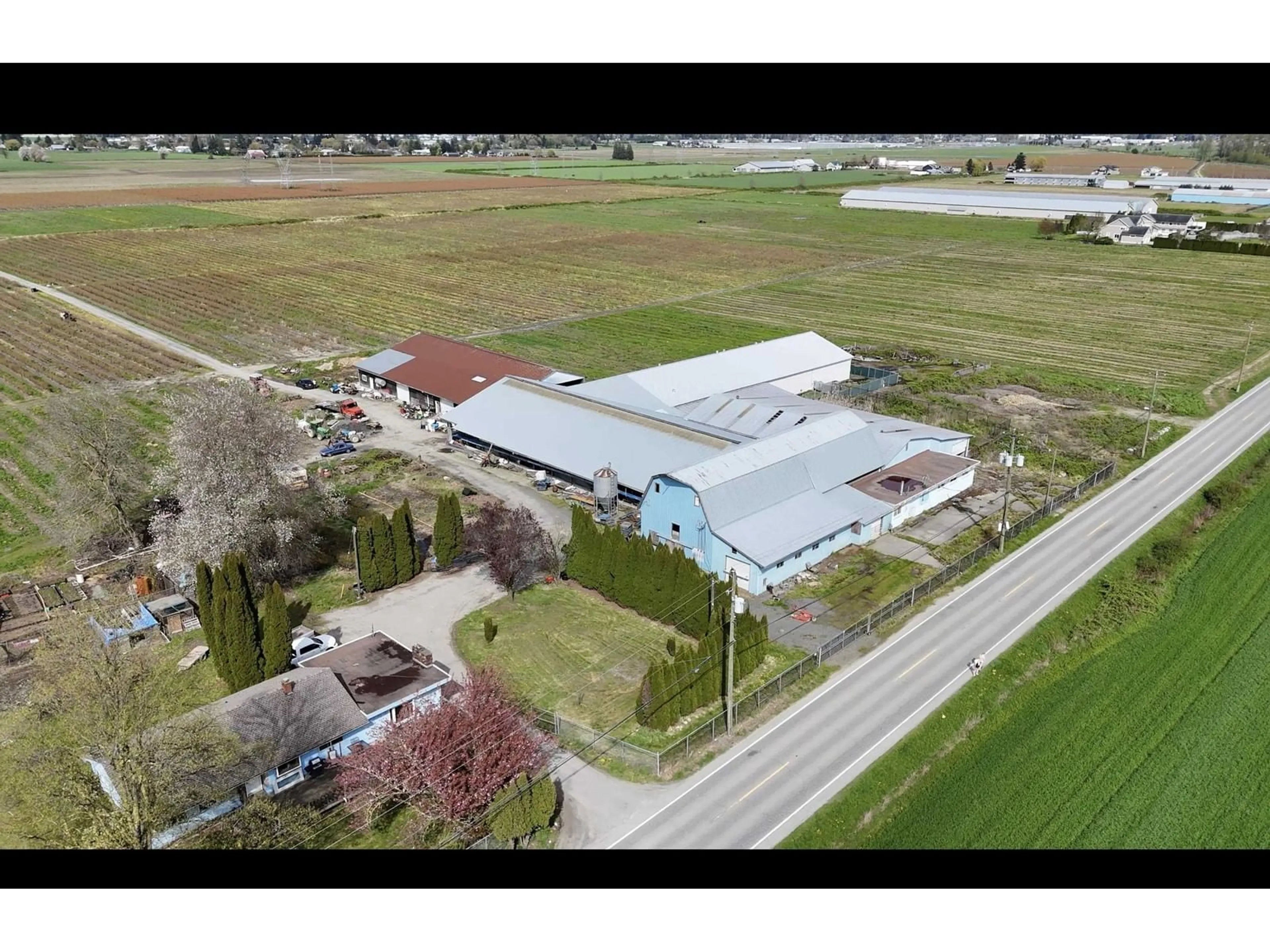 A pic from outside/outdoor area/front of a property/back of a property/a pic from drone, building for 42747 KEITH WILSON ROAD, Chilliwack British Columbia V2R4B3