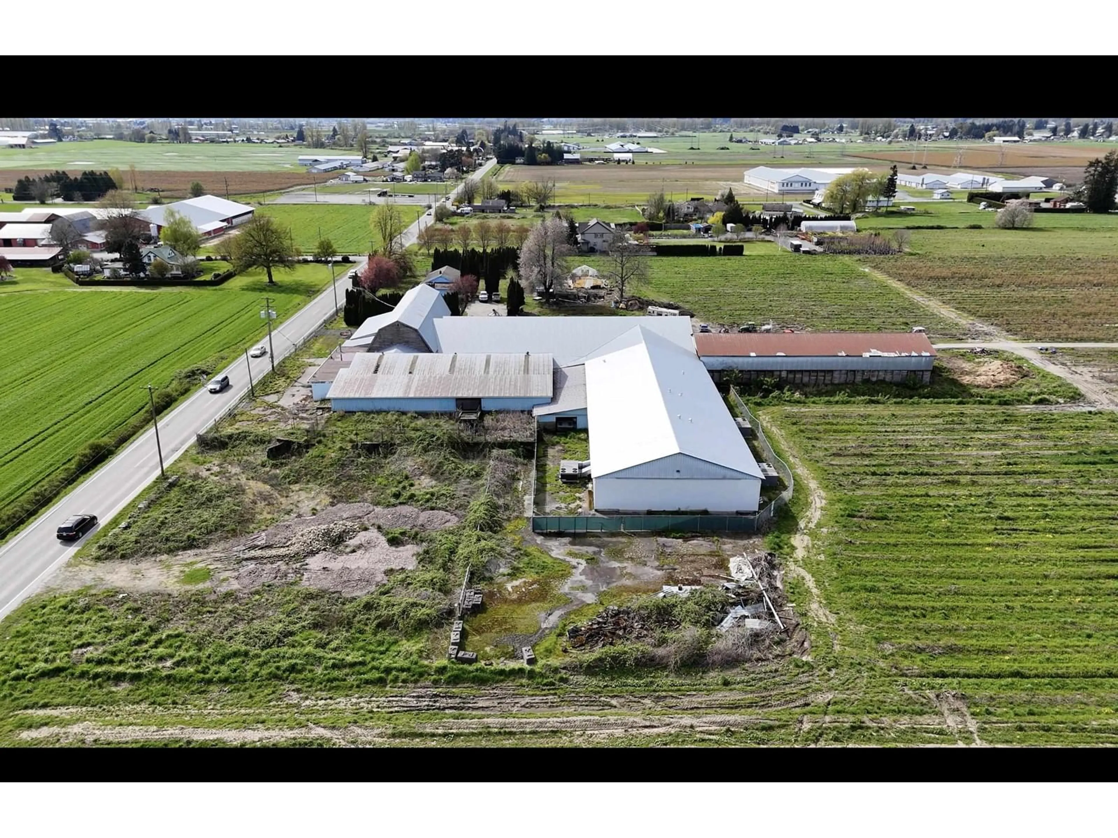 A pic from outside/outdoor area/front of a property/back of a property/a pic from drone, building for 42747 KEITH WILSON ROAD, Chilliwack British Columbia V2R4B3